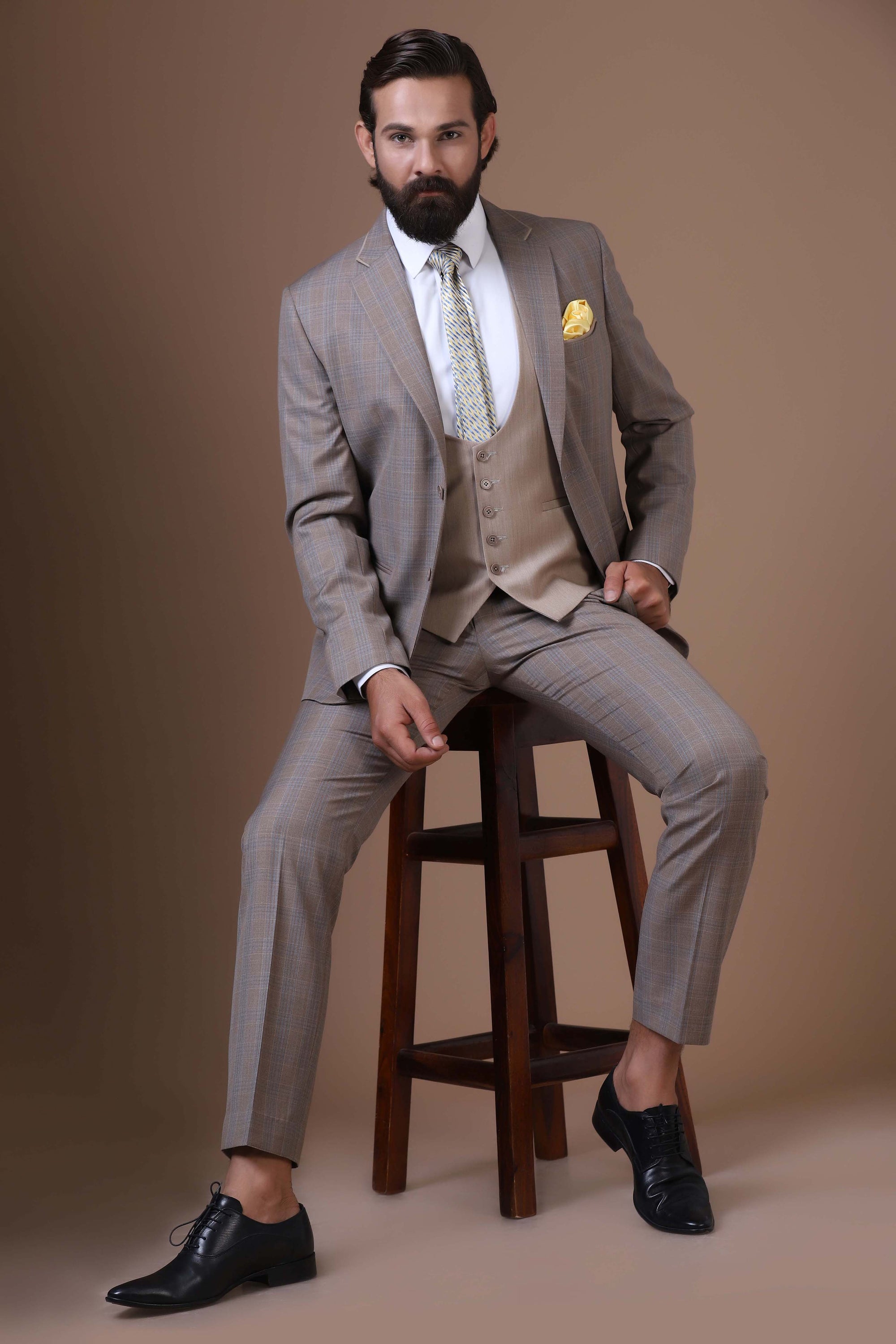 Step into sophistication with our Beige 3-Piece suit featuring a contrast waistcoat. Shop Now!