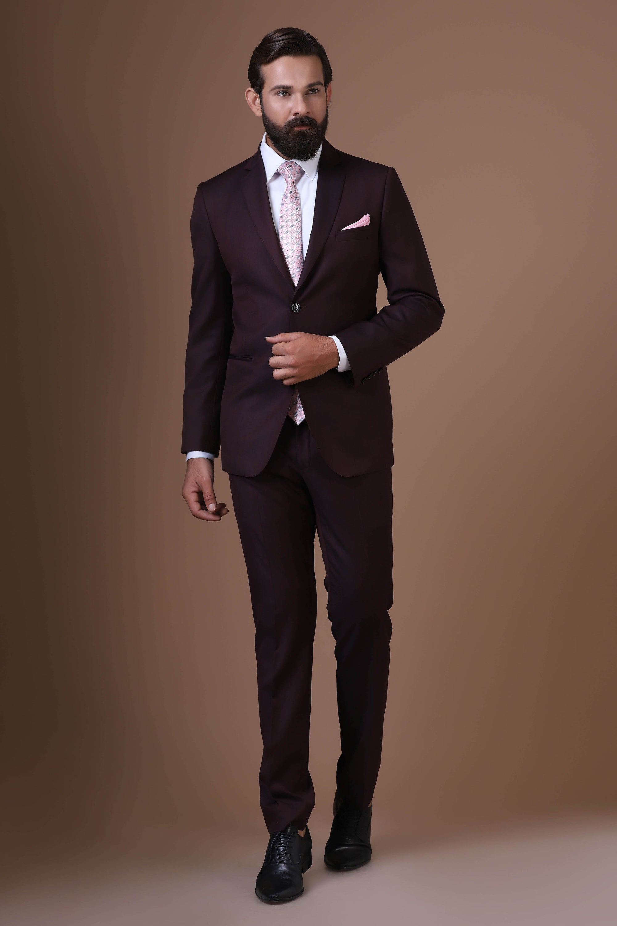 Elevate your style with our Wine Melange Wool-rich suit, exuding timeless sophistication. Shop Now!