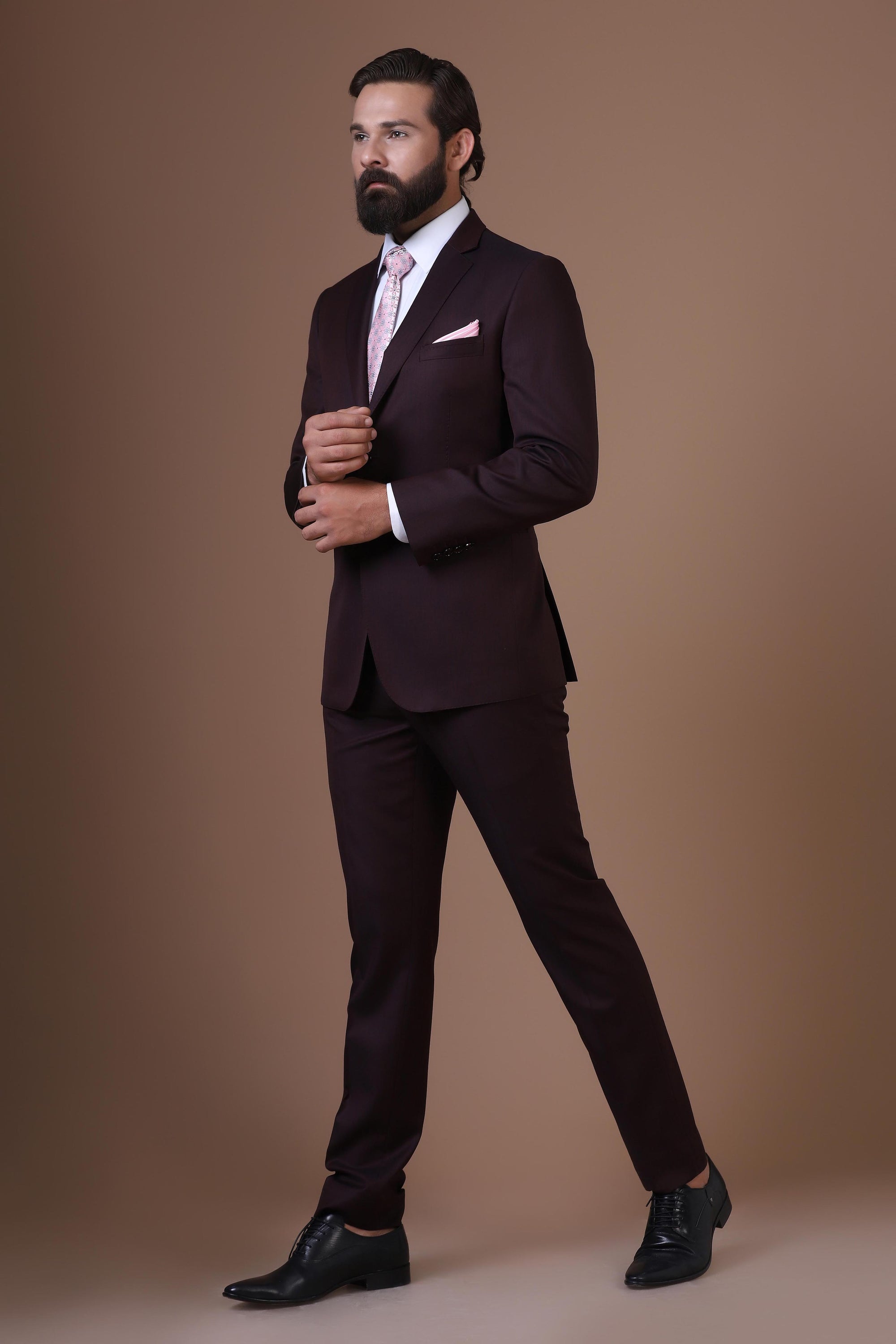 Elevate your style with our Wine Melange Wool-rich suit, exuding timeless sophistication. Shop Now!