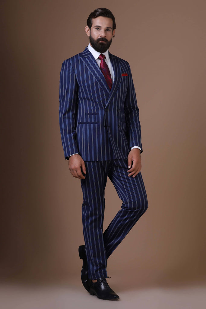Make a statement with our bold double-breasted suit in striking navy blue pin-stripe fabric. 2-button closure, peak lapels, wool-rich fabric.