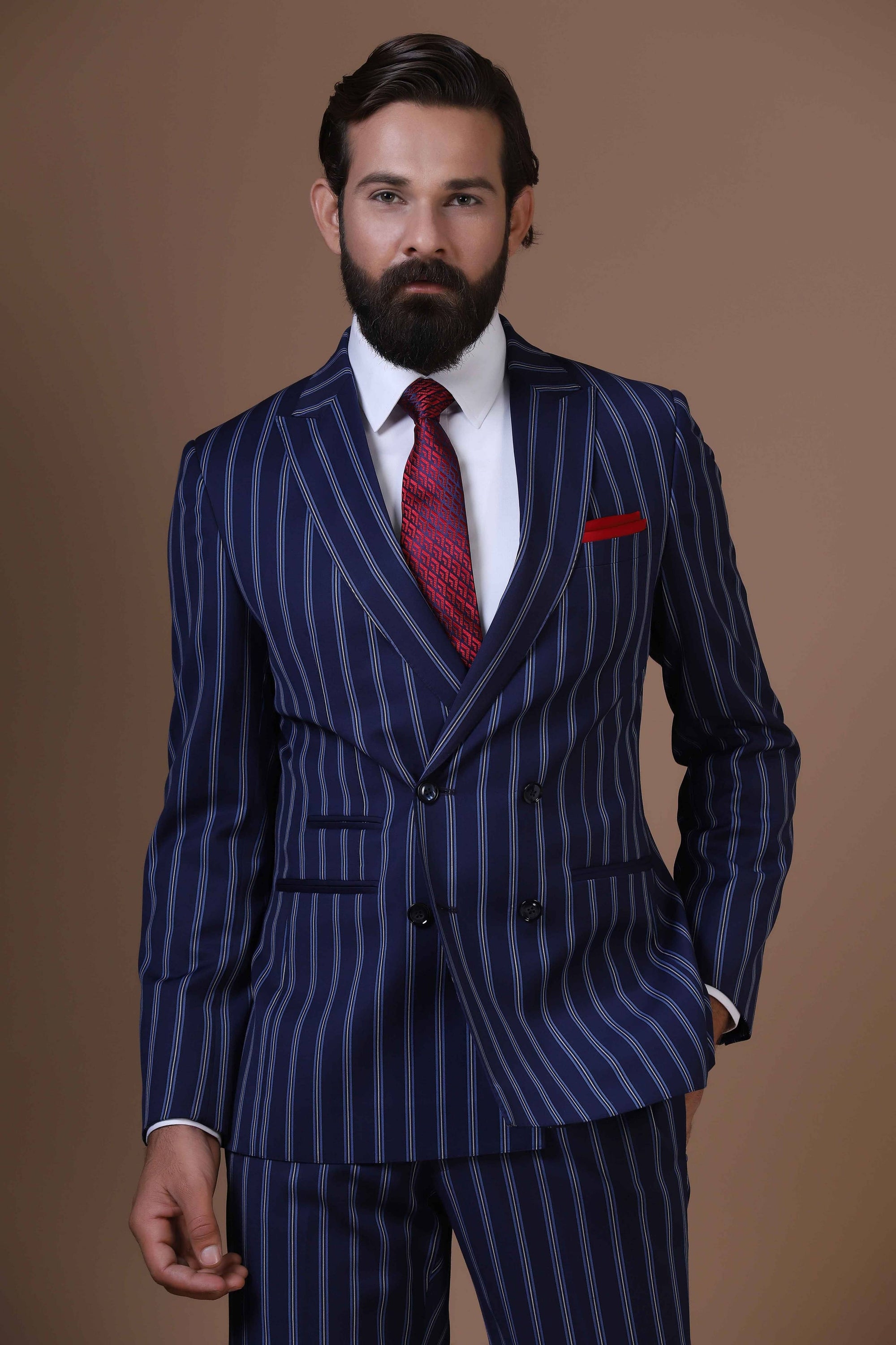 Make statement with our bold double-breasted suit in striking navy blue pin-stripe fabric. Shop Now!
