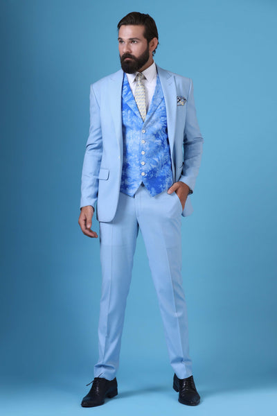 Elevate your style with this 3-piece suit featuring a printed waistcoat with a peak lapel. Single button closure, crafted from light blue wool-rich fabric.