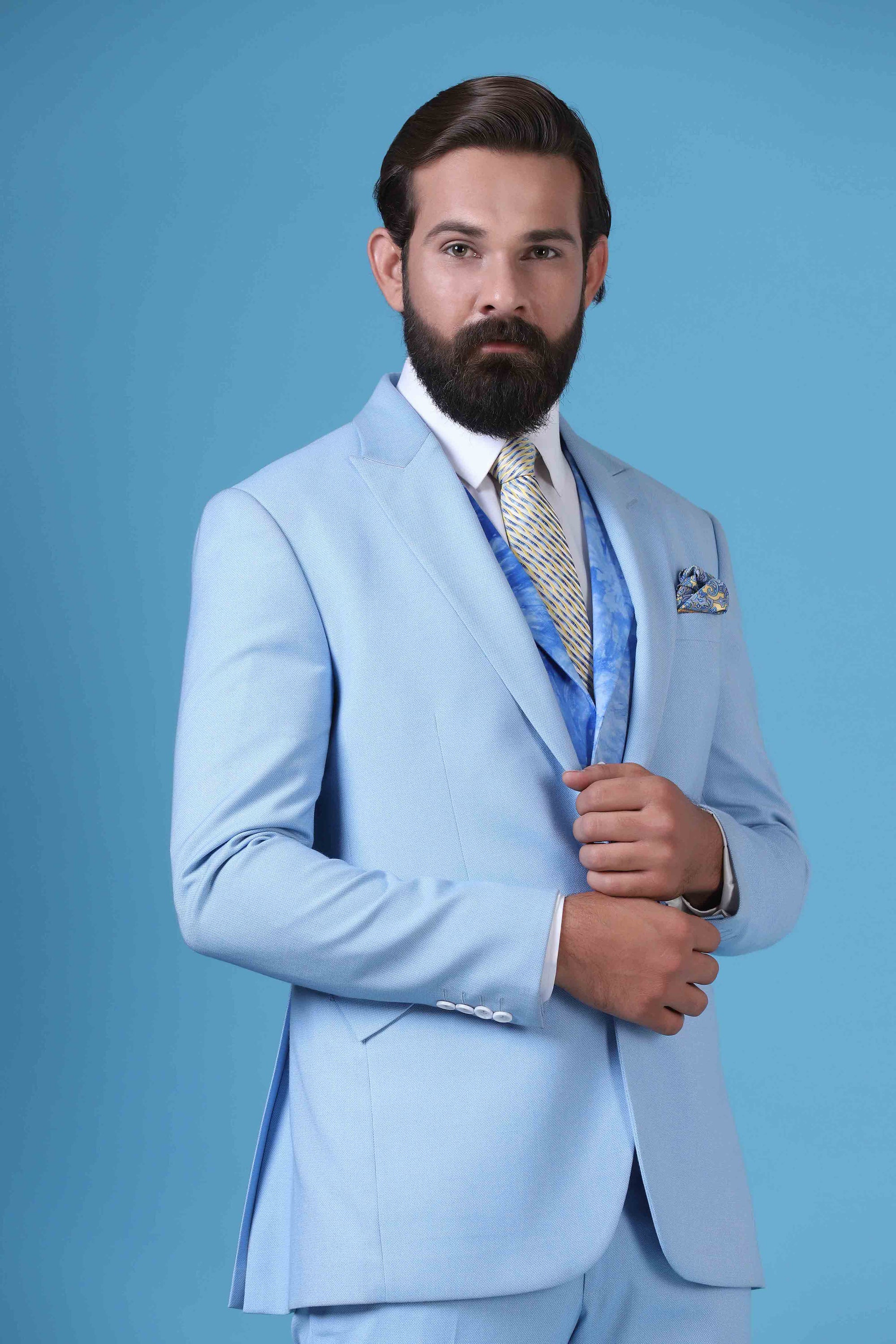 Elevate your style with this 3-piece suit featuring a printed waistcoat with a peak lapel. Shop Now!