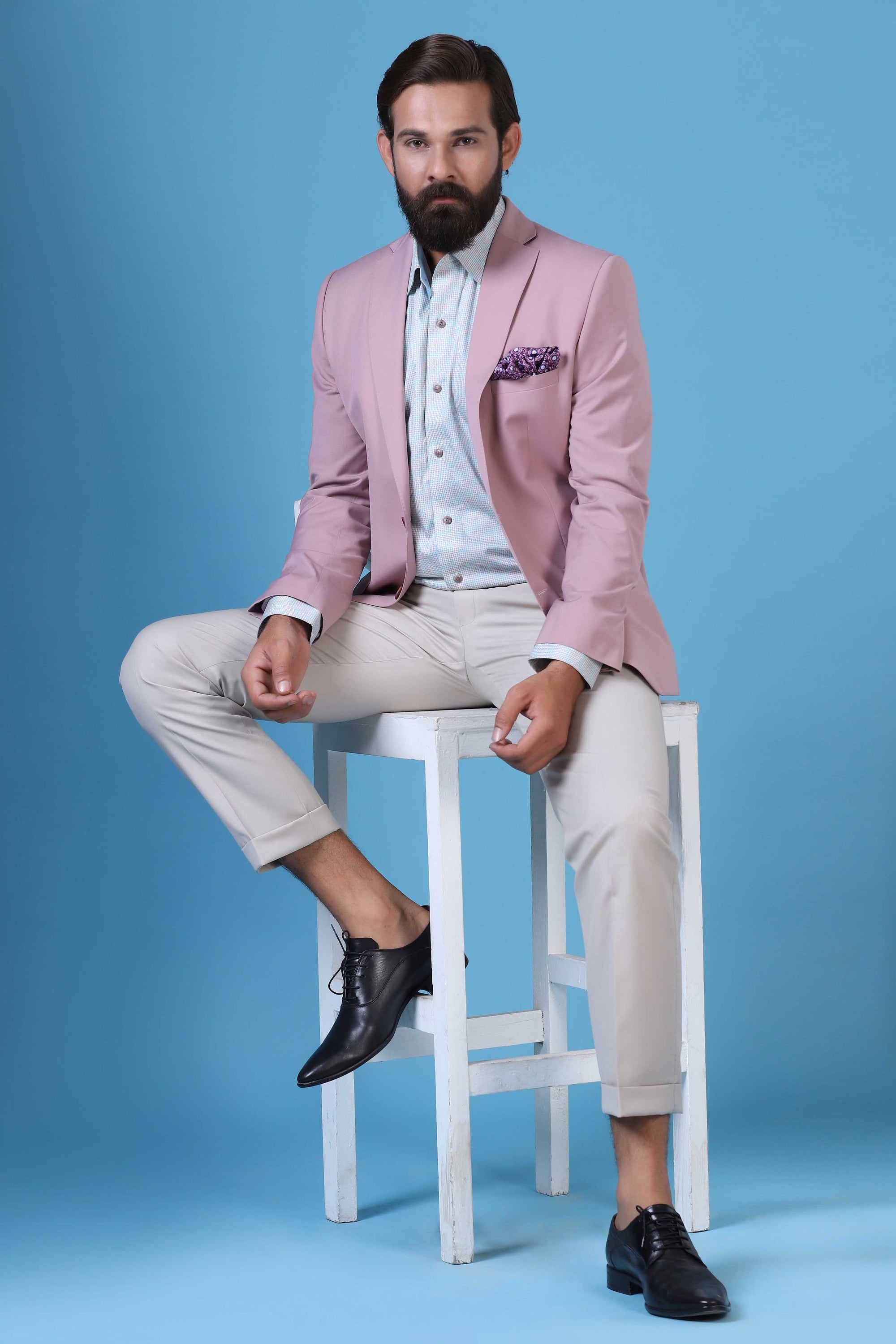 Step into elegance with our soft pink blazer and beige trousers combination. Shop Now!
