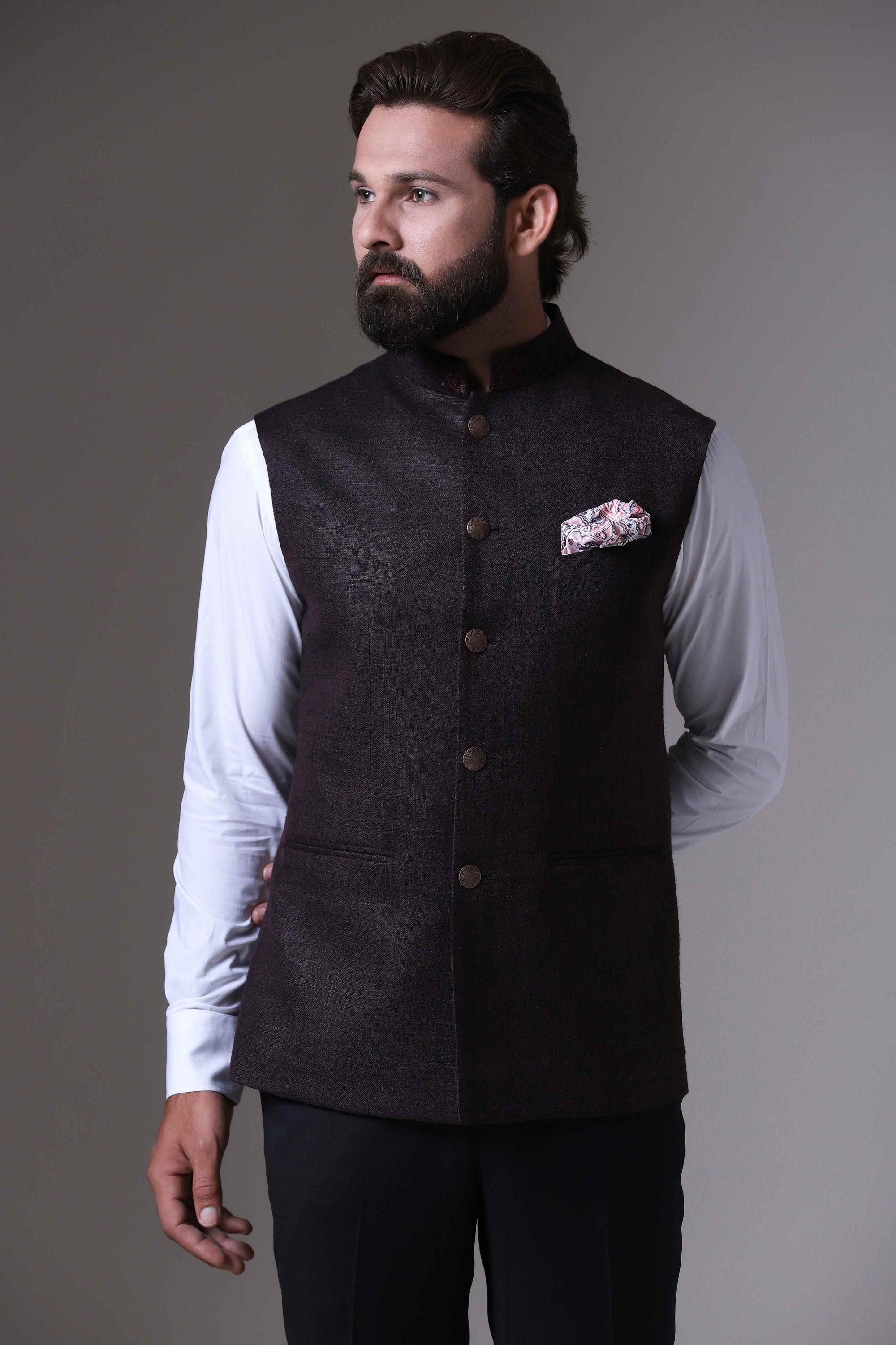 This classic brown Nehru Jacket is made using handloom silk fabric. Shop Now!