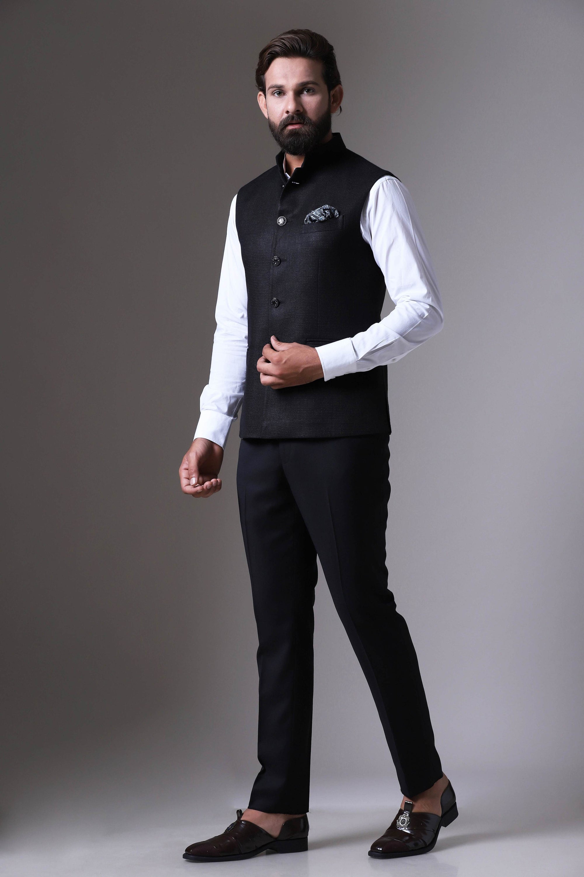 This classic black Nehru Jacket is made using handloom silk fabric. Shop Now!