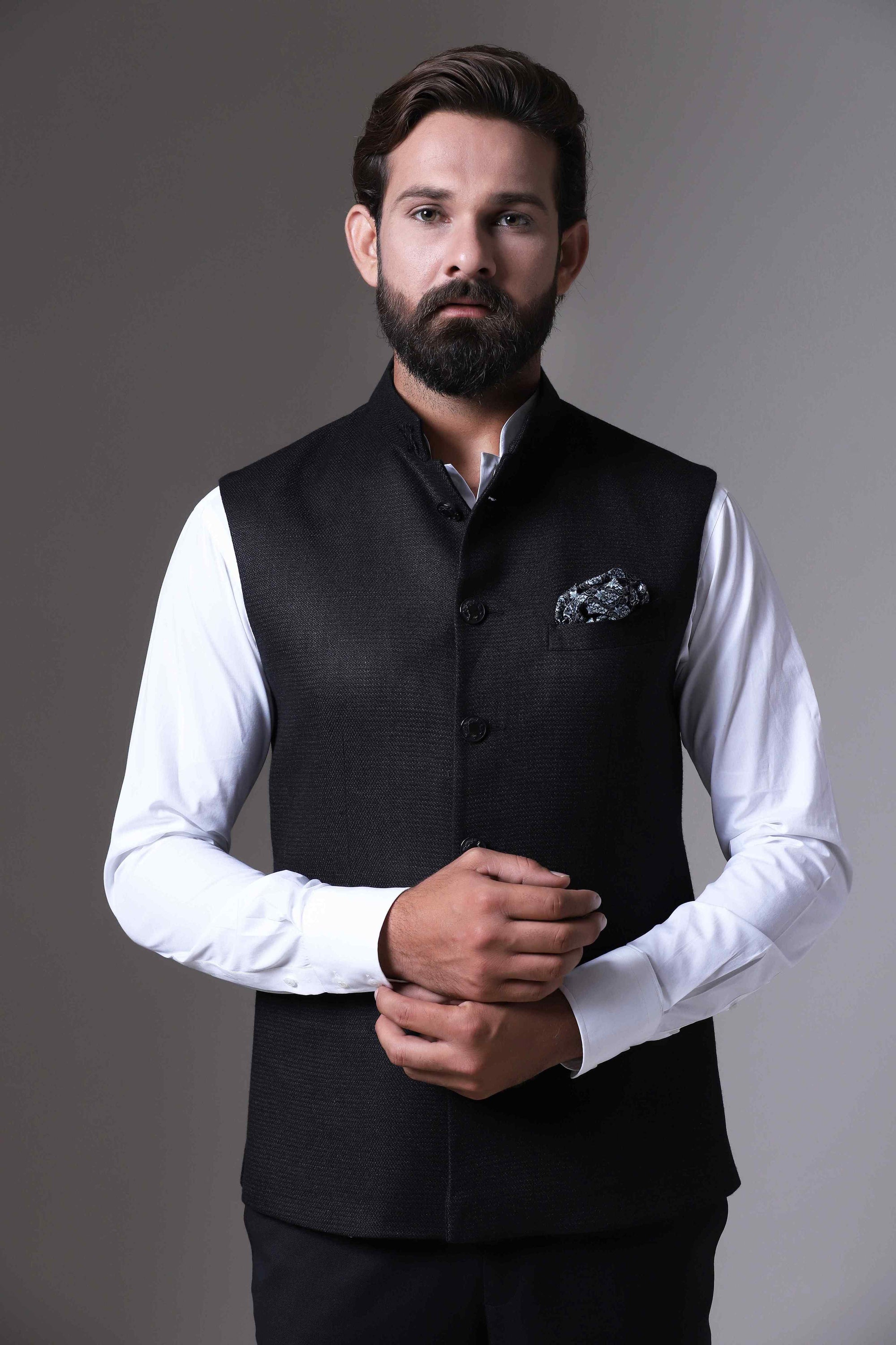 This classic black Nehru Jacket is made using handloom silk fabric. Shop Now!