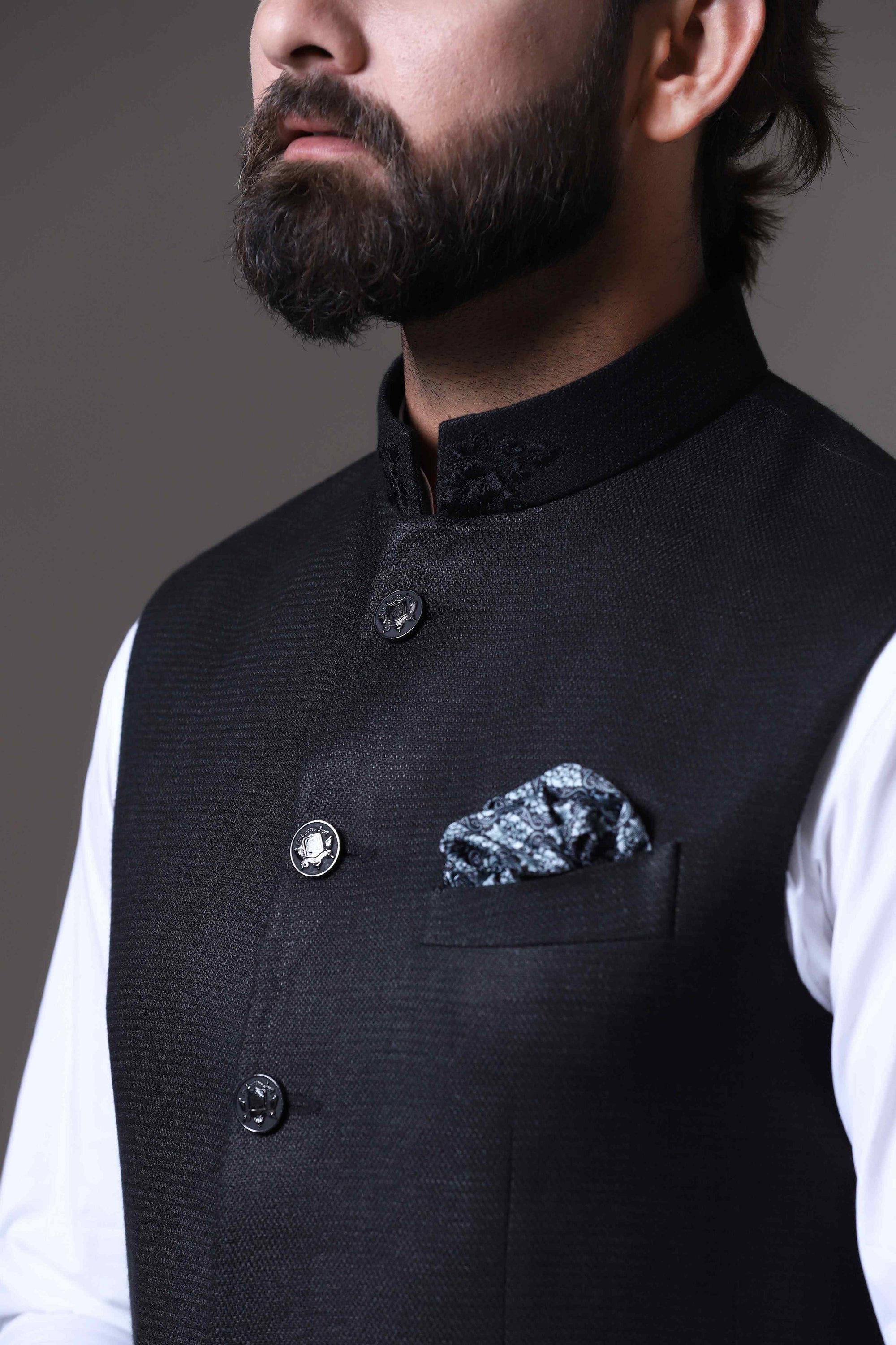 This classic black Nehru Jacket is made using handloom silk fabric. Shop Now!