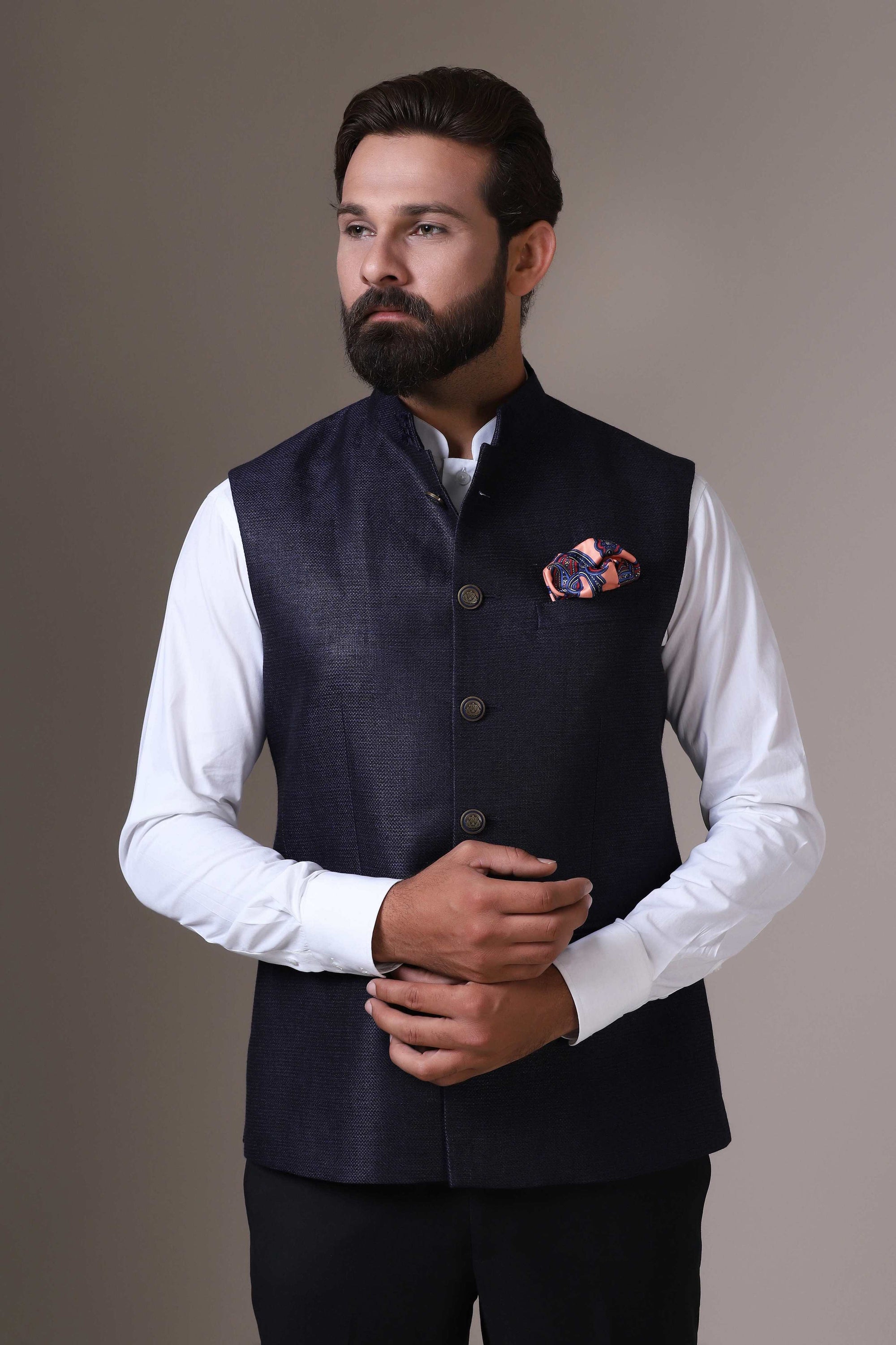 This classic Navy Blue Nehru Jacket is made using handloom silk fabric. Shop Now!