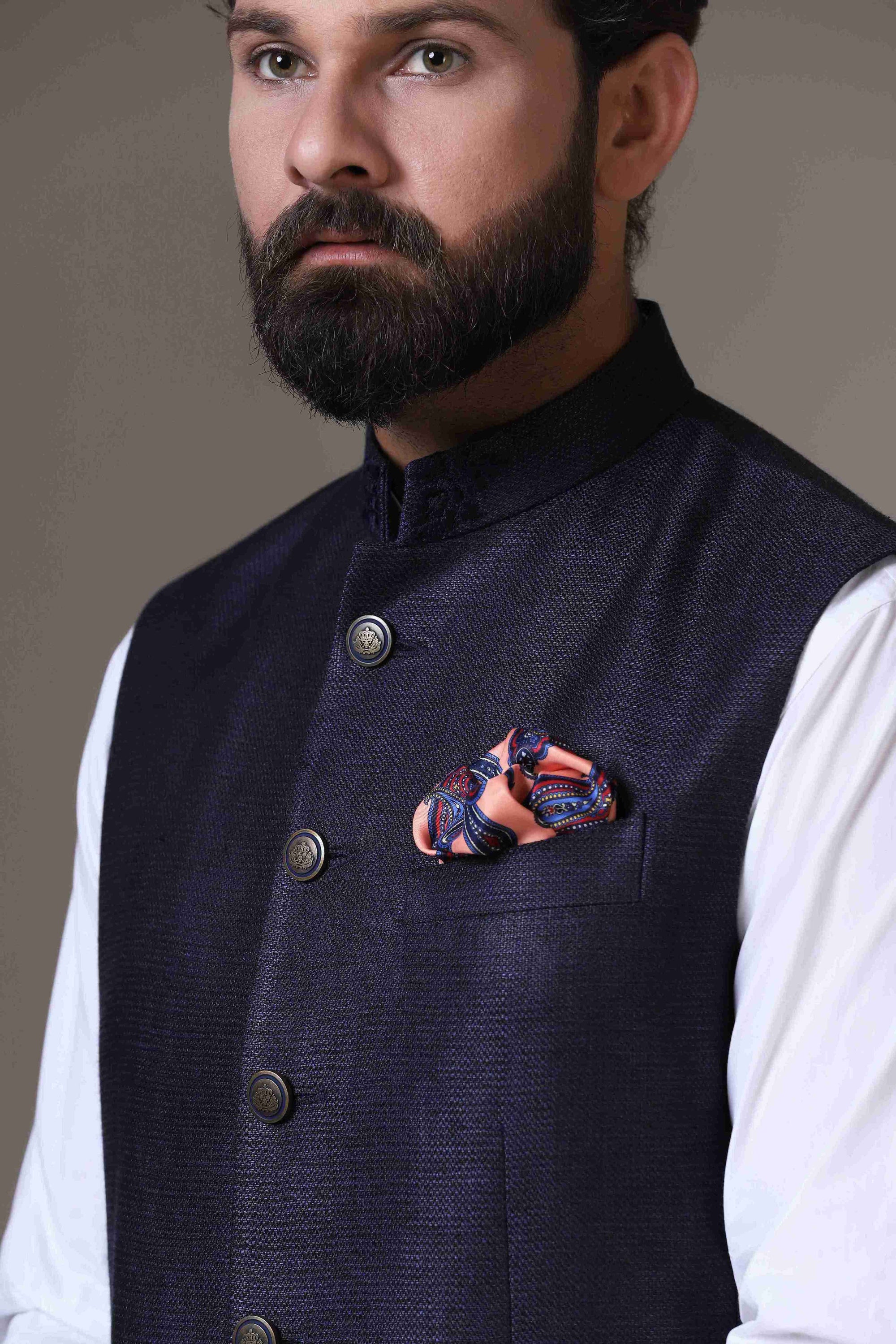 This classic Navy Blue Nehru Jacket is made using handloom silk fabric. Shop Now!