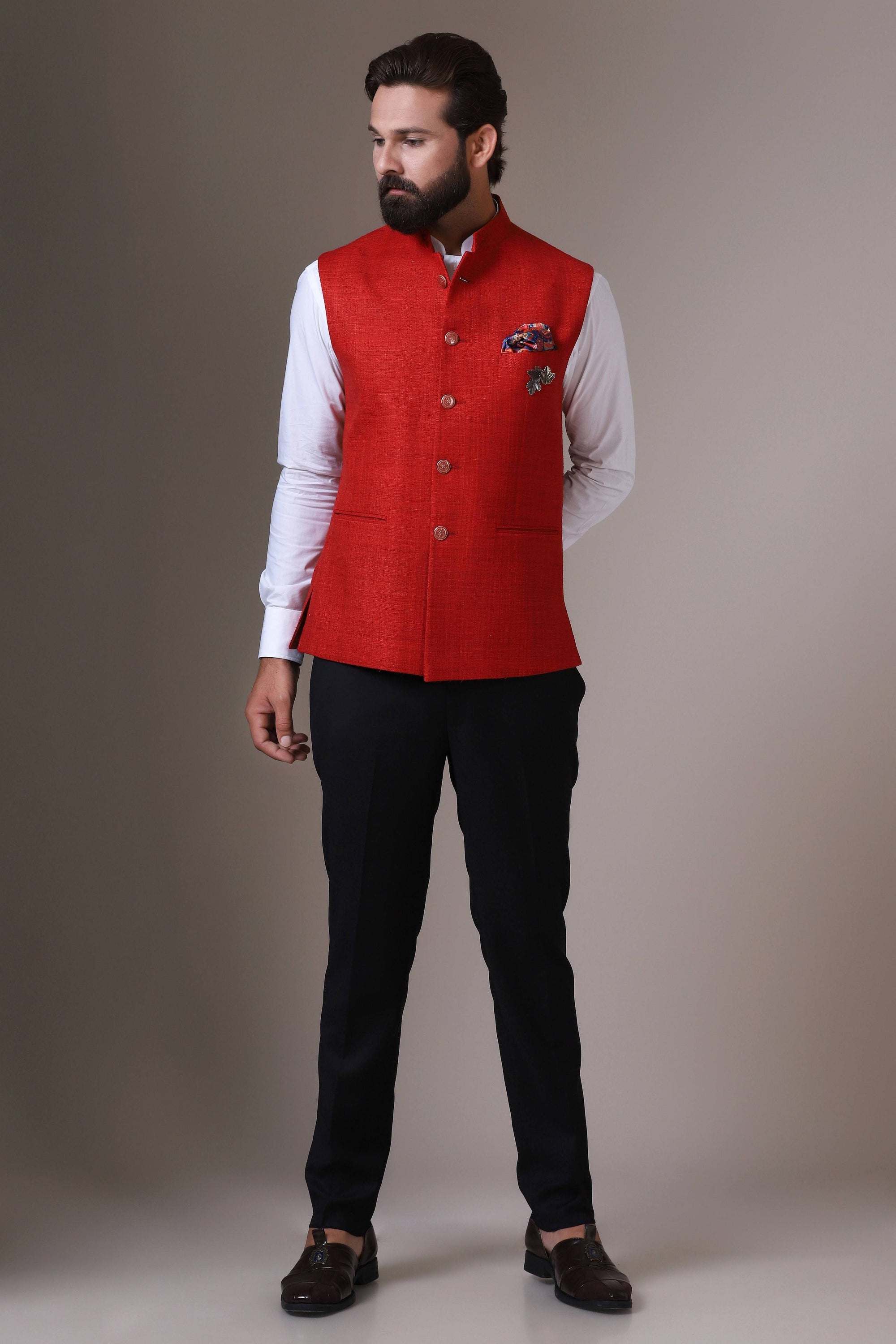 This vibrant red Nehru Jacket is made using handloom silk fabric. Shop Now!