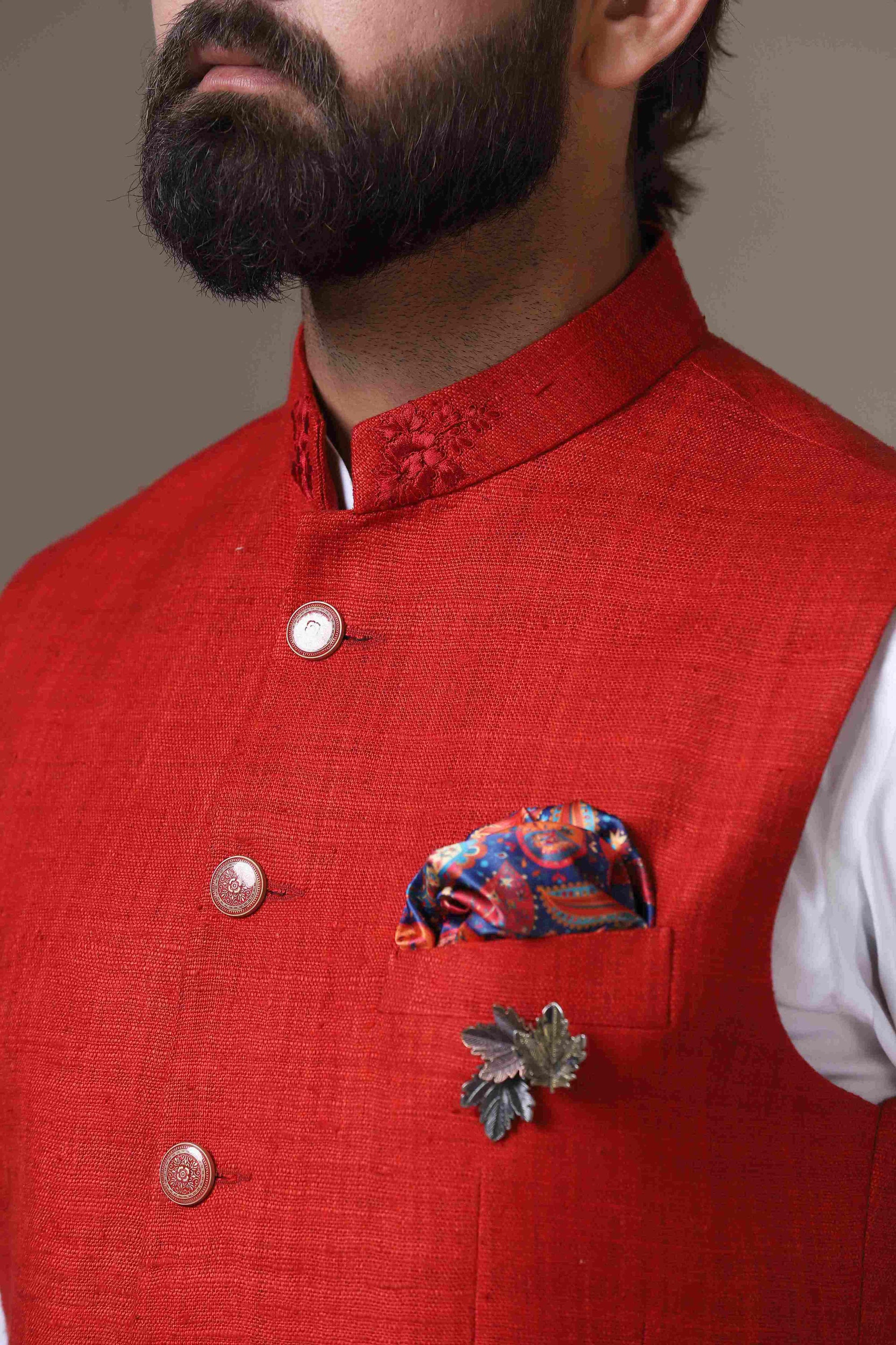 This vibrant red Nehru Jacket is made using handloom silk fabric. Shop Now!