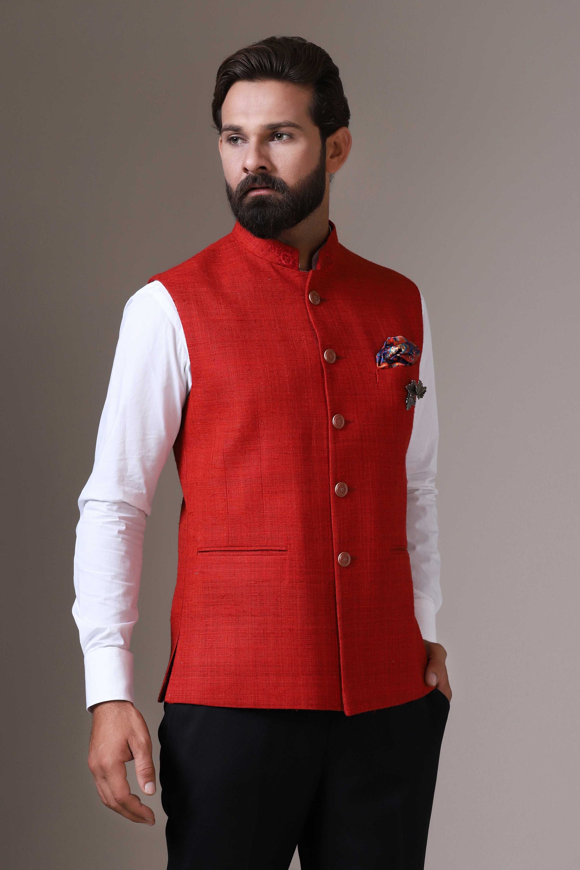 This vibrant red Nehru Jacket is made using handloom silk fabric. Shop Now!