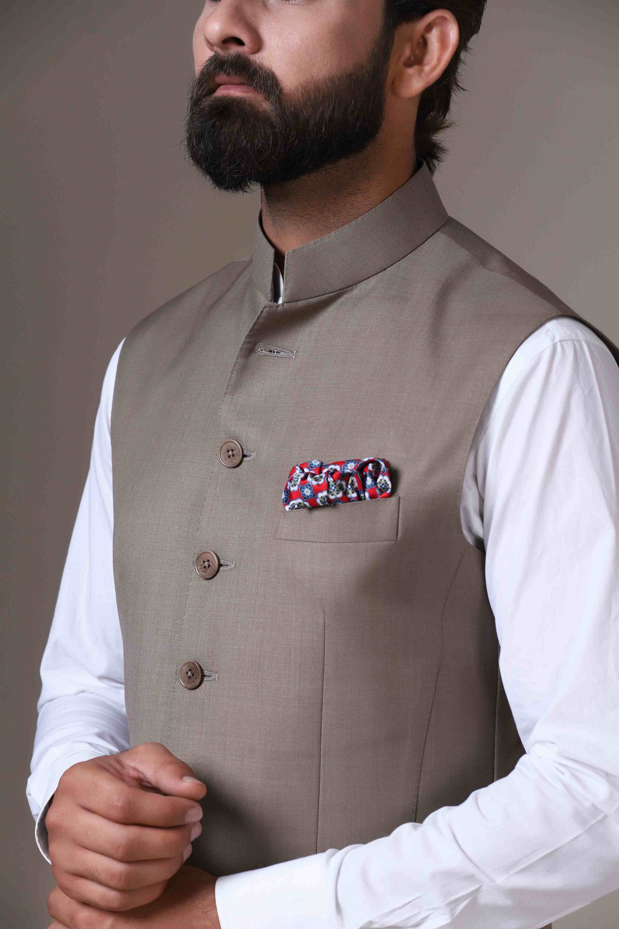Elevate your style with our beige Nehru Jacket crafted from wool-rich fabric. Shop Now!