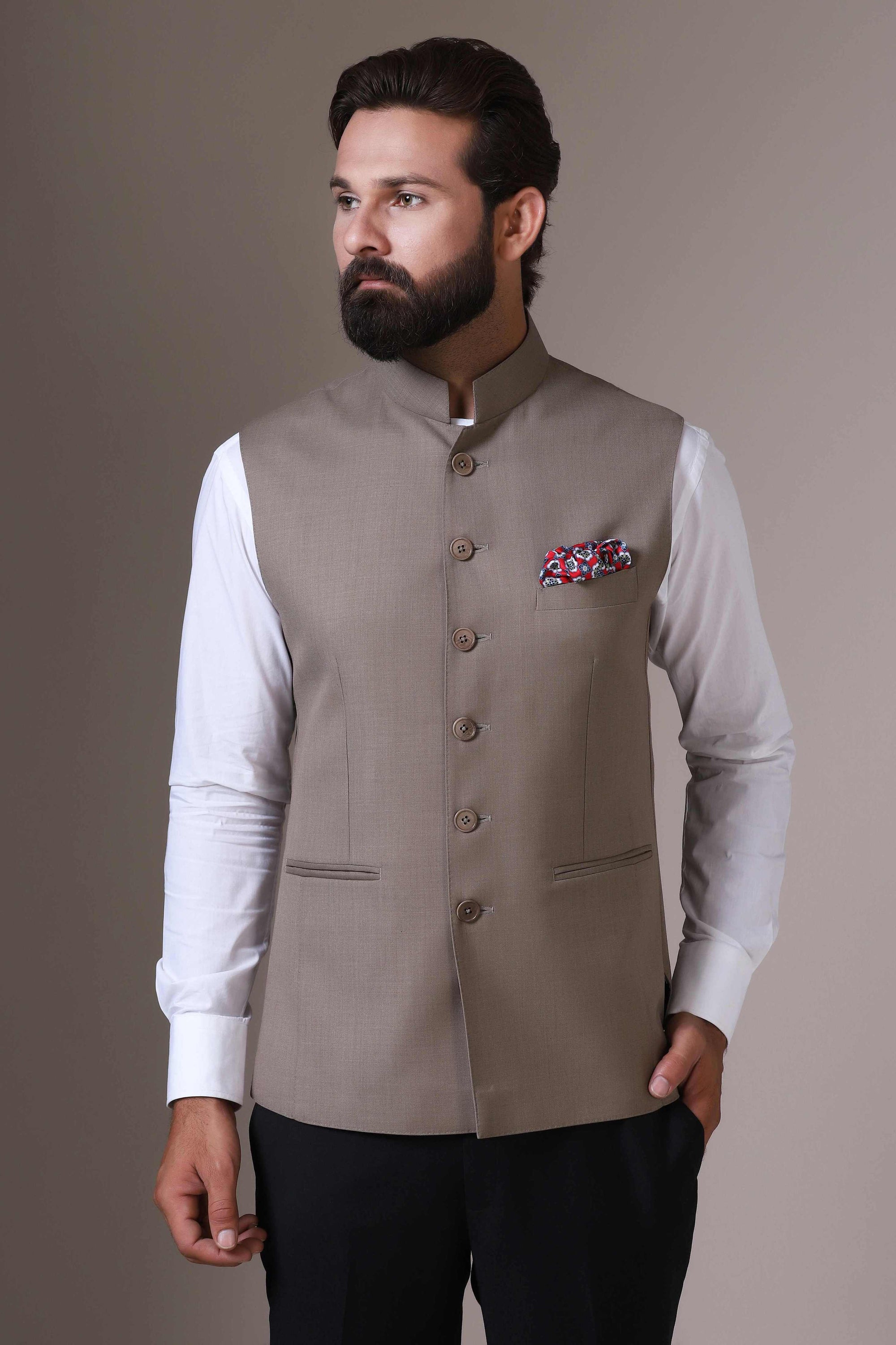 Elevate your style with our beige Nehru Jacket crafted from wool-rich fabric. Shop Now!