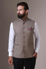Elevate your style with our beige Nehru Jacket crafted from wool-rich fabric. Its lightweight construction and minimalist design transition seamlessly from business meetings to wedding events.