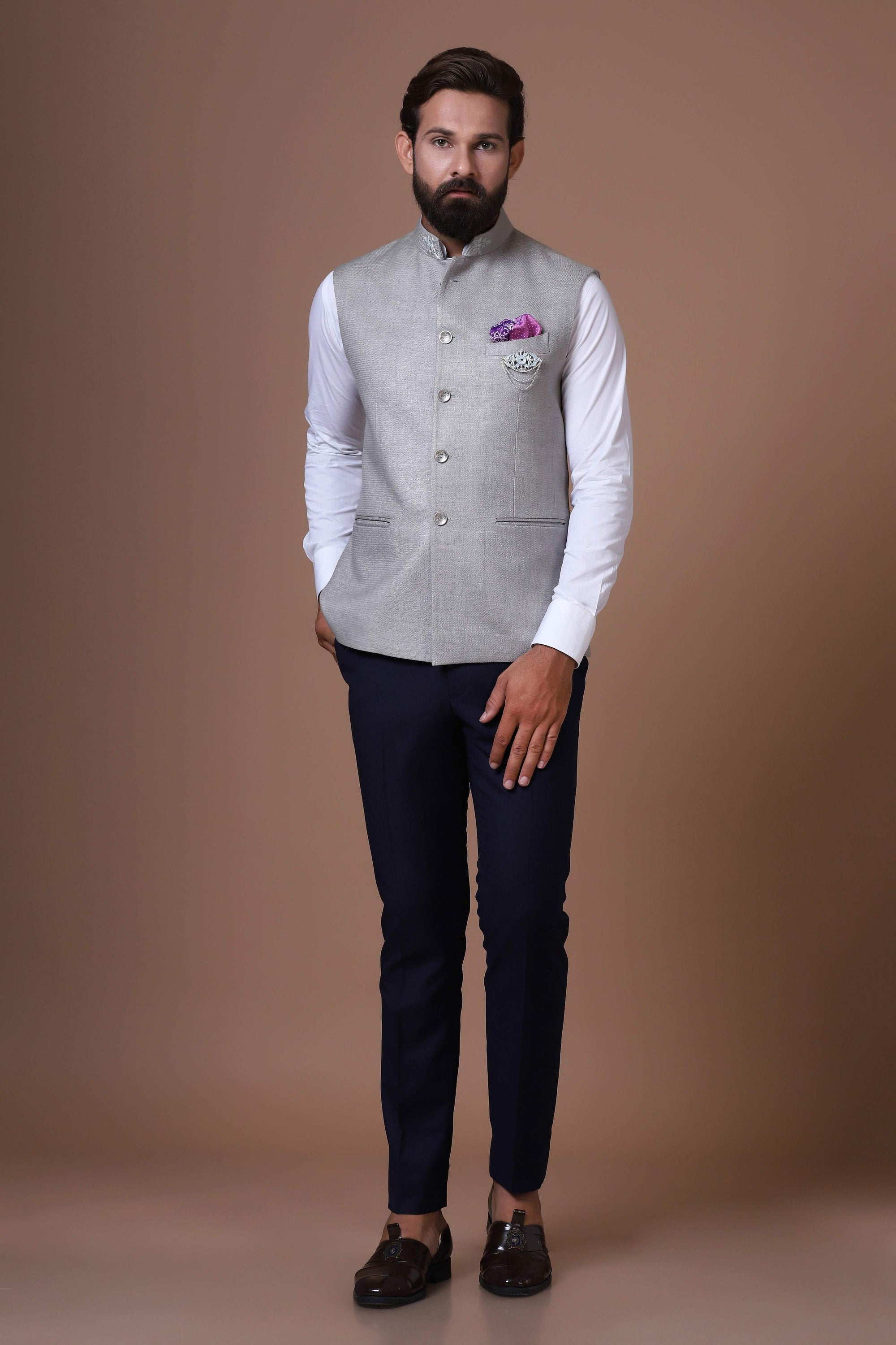 This soft grey Nehru Jacket is made using handloom silk fabric. Shop Now!