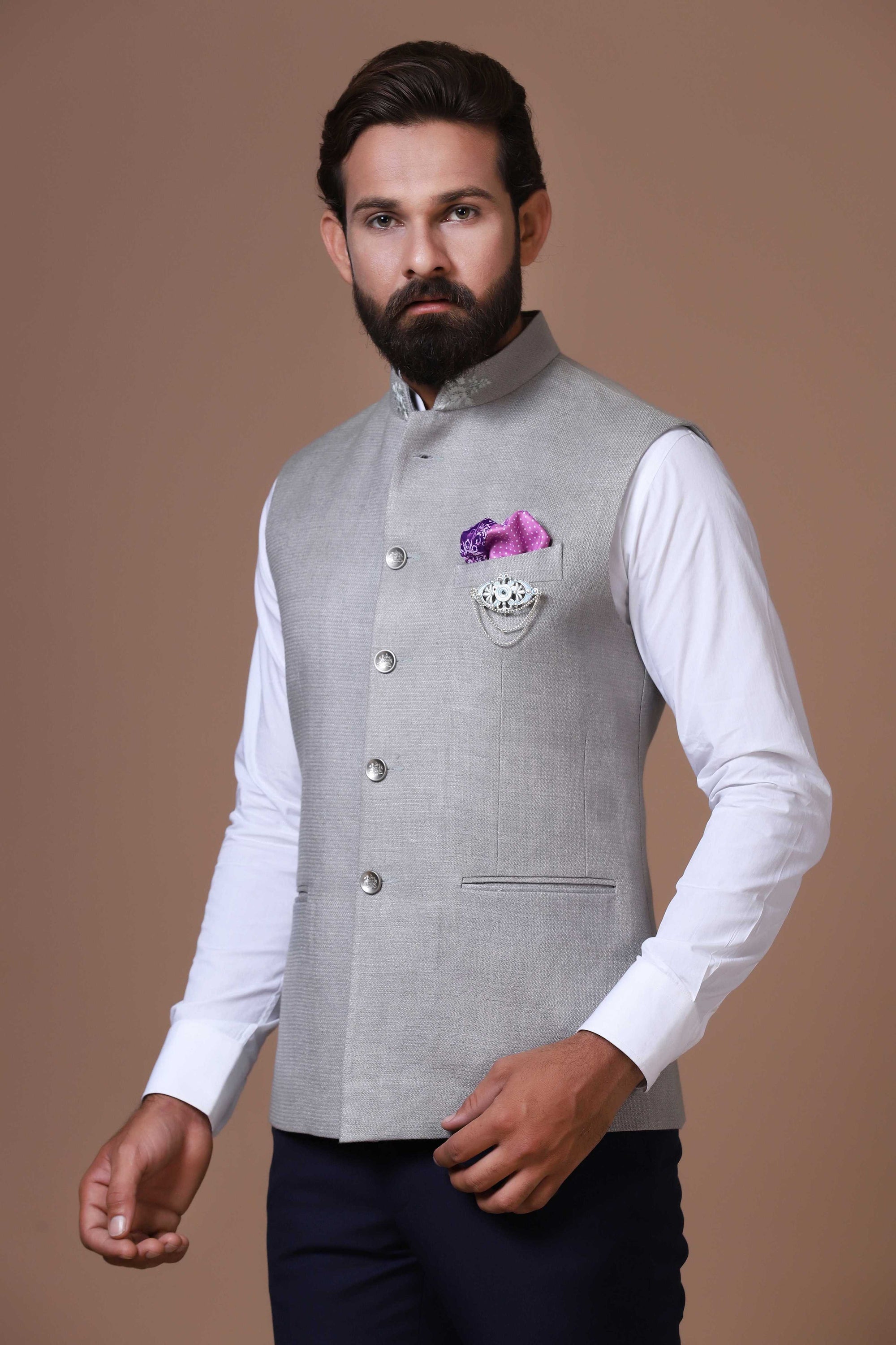 This soft grey Nehru Jacket is made using handloom silk fabric. Shop Now!