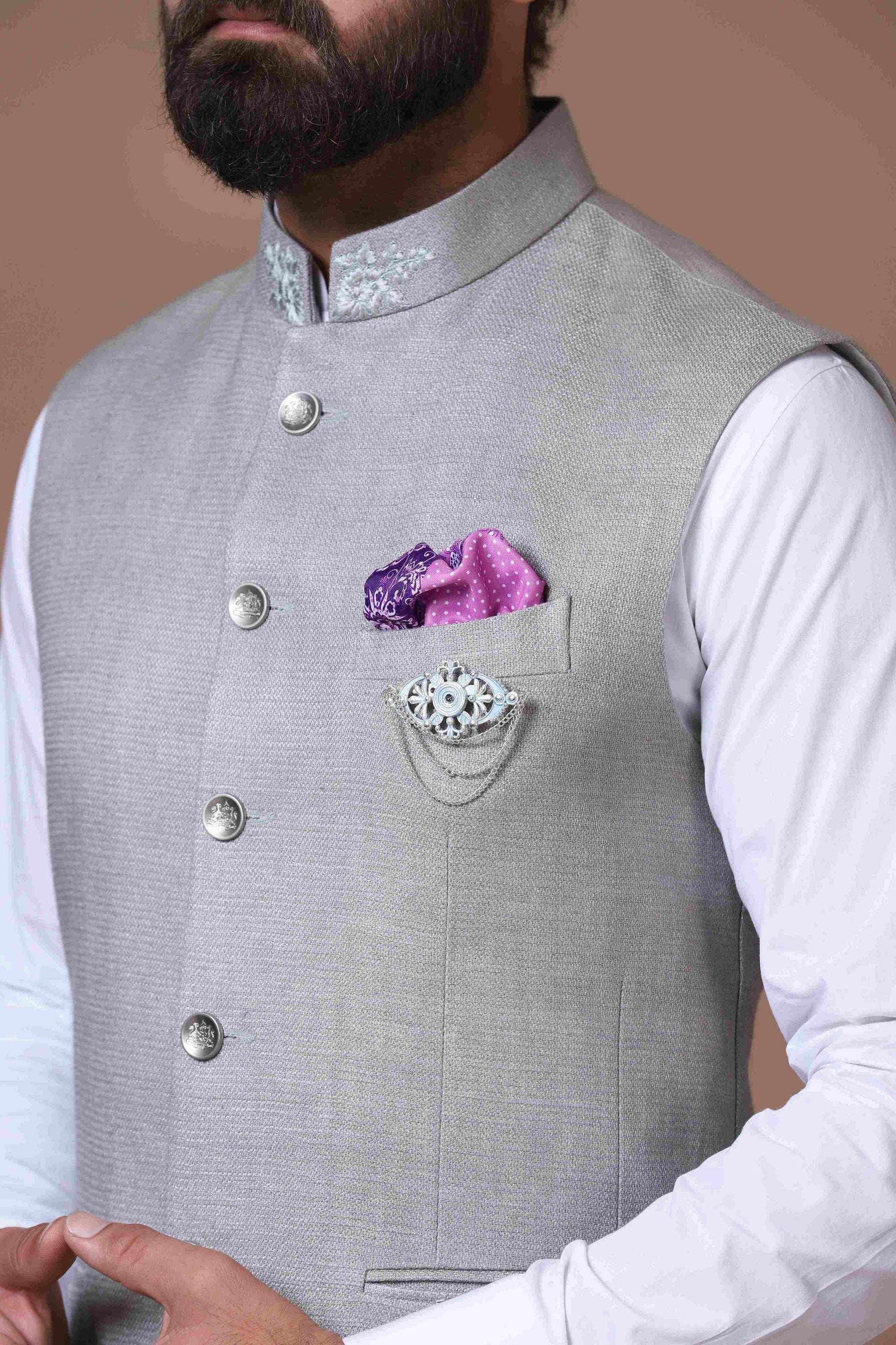 This soft grey Nehru Jacket is made using handloom silk fabric. Shop Now!