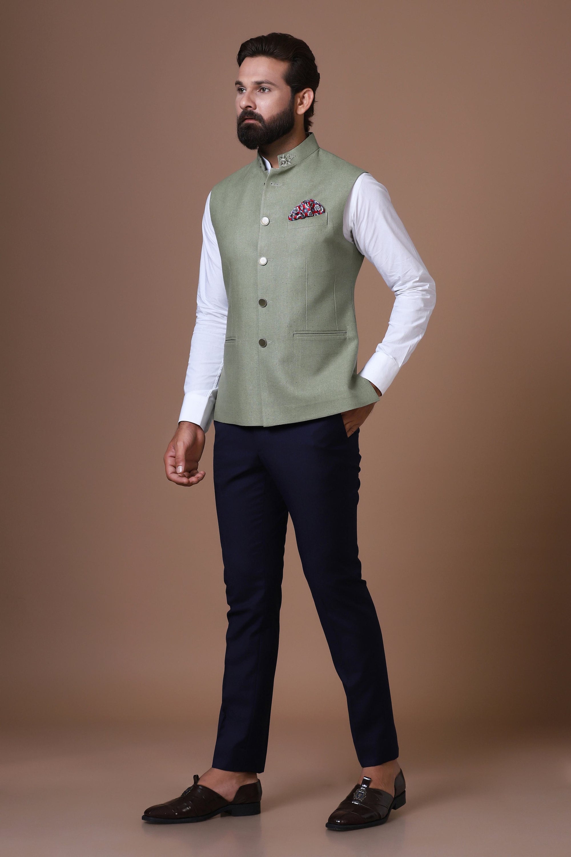 This classic Green Nehru Jacket is made using handloom silk fabric. Shop Now!