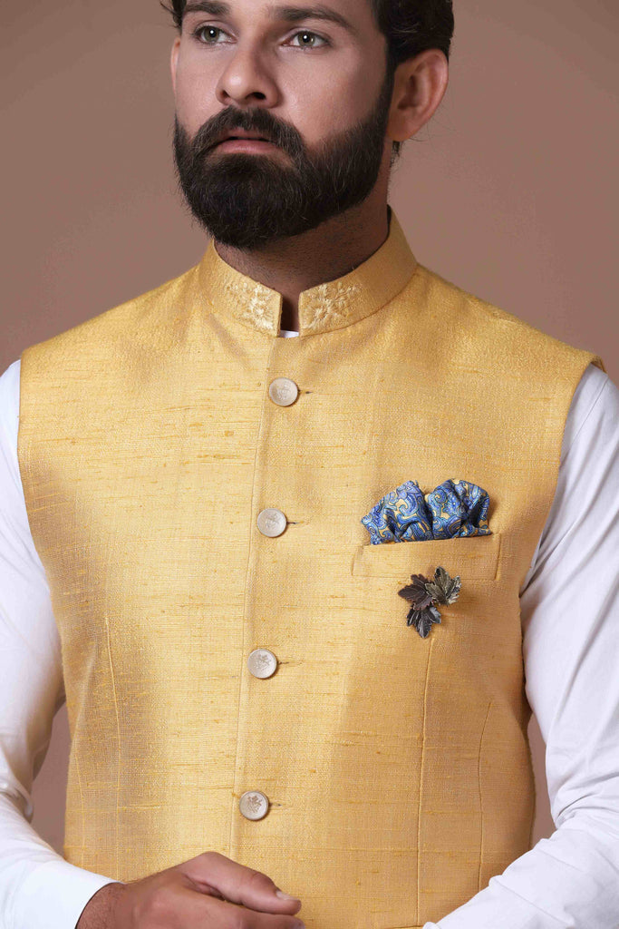 This Yellow Nehru Jacket is made using handloom raw-silk fabric. Shop Now!