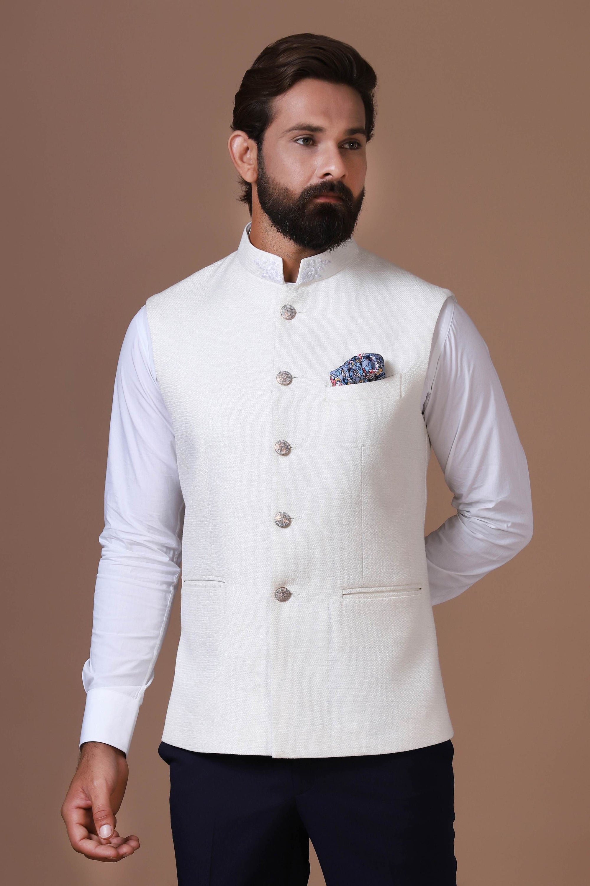 Exude elegance with our classic white Nehru Jacket, crafted from handloom silk fabric. Shop Now!