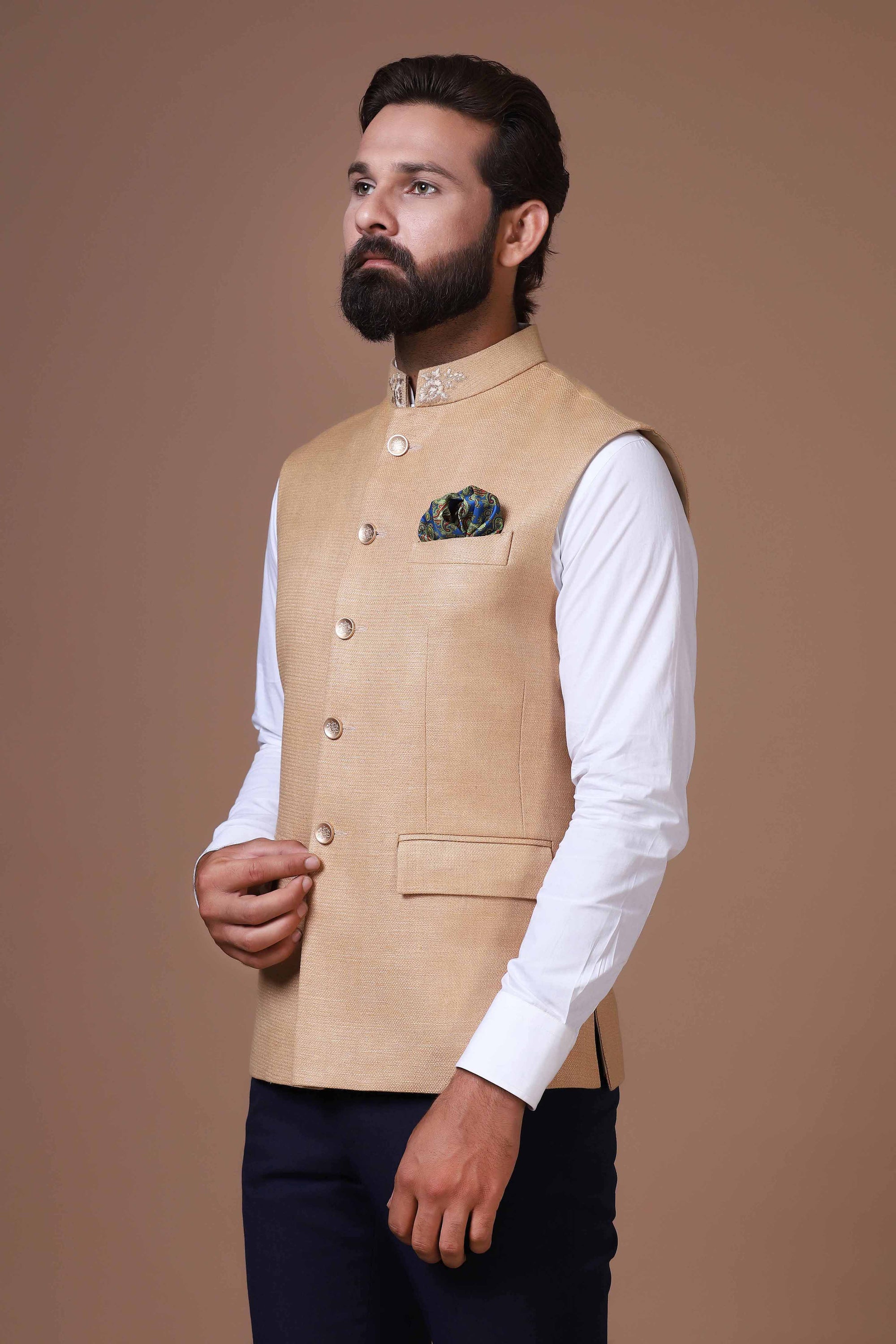 This classic white Nehru Jacket is made using handloom silk fabric. Shop Now!
