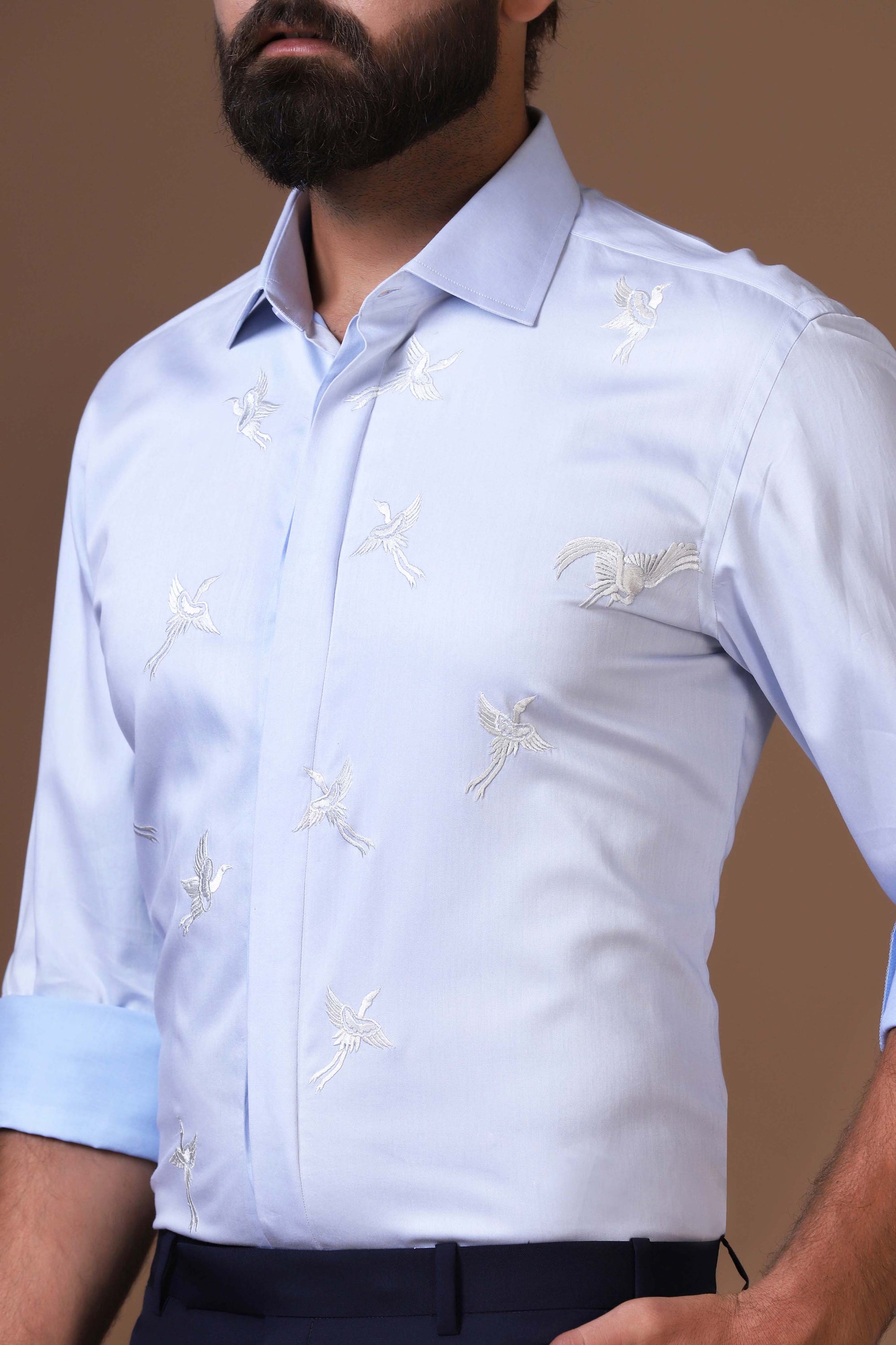 Step into style with a beautifully embroidered Blue Shirt. Shop Now!