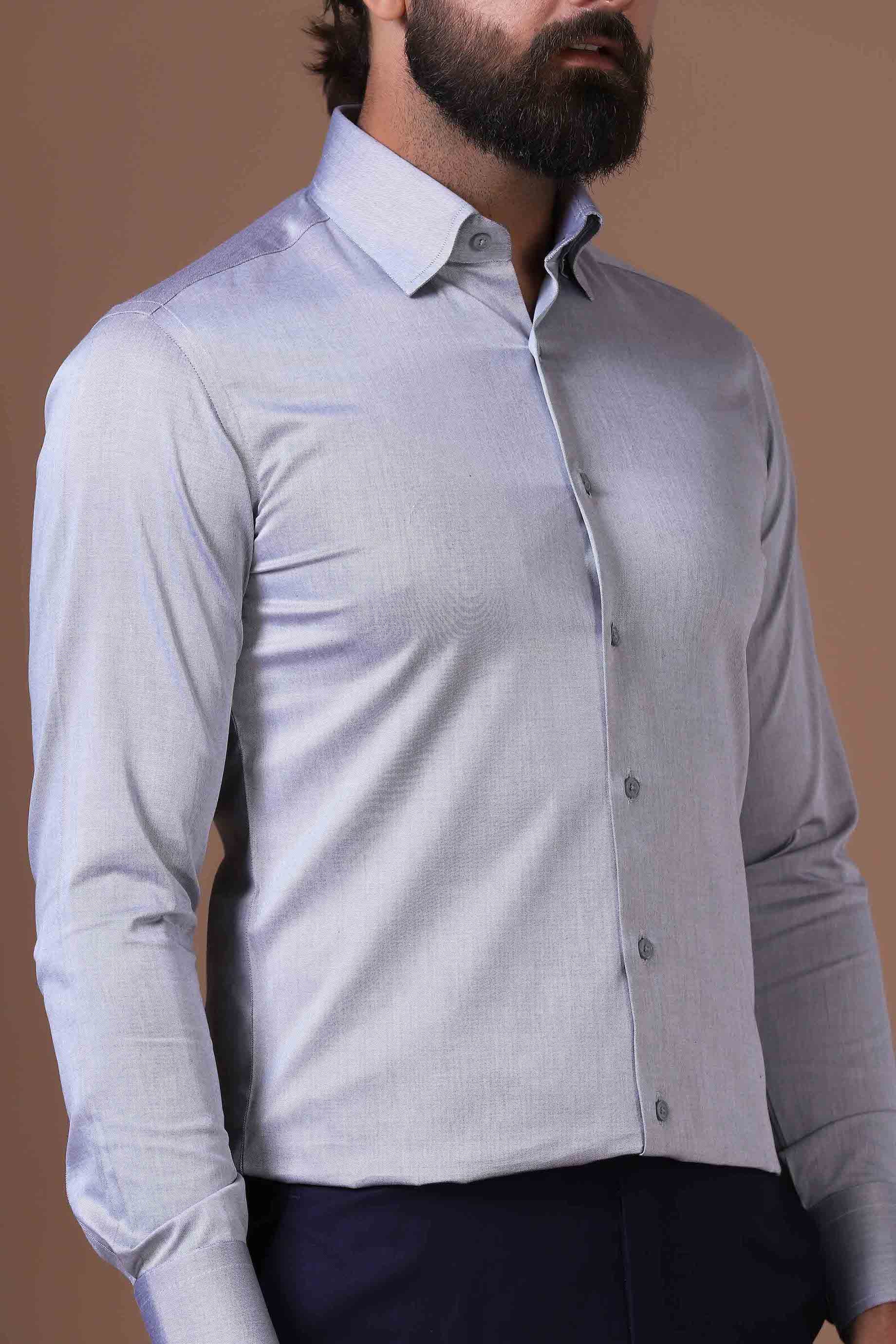 Effortless sophistication in our 100% cotton grey shirt. Concealed button-down collar and French placket elevate your everyday style. Shop Now!