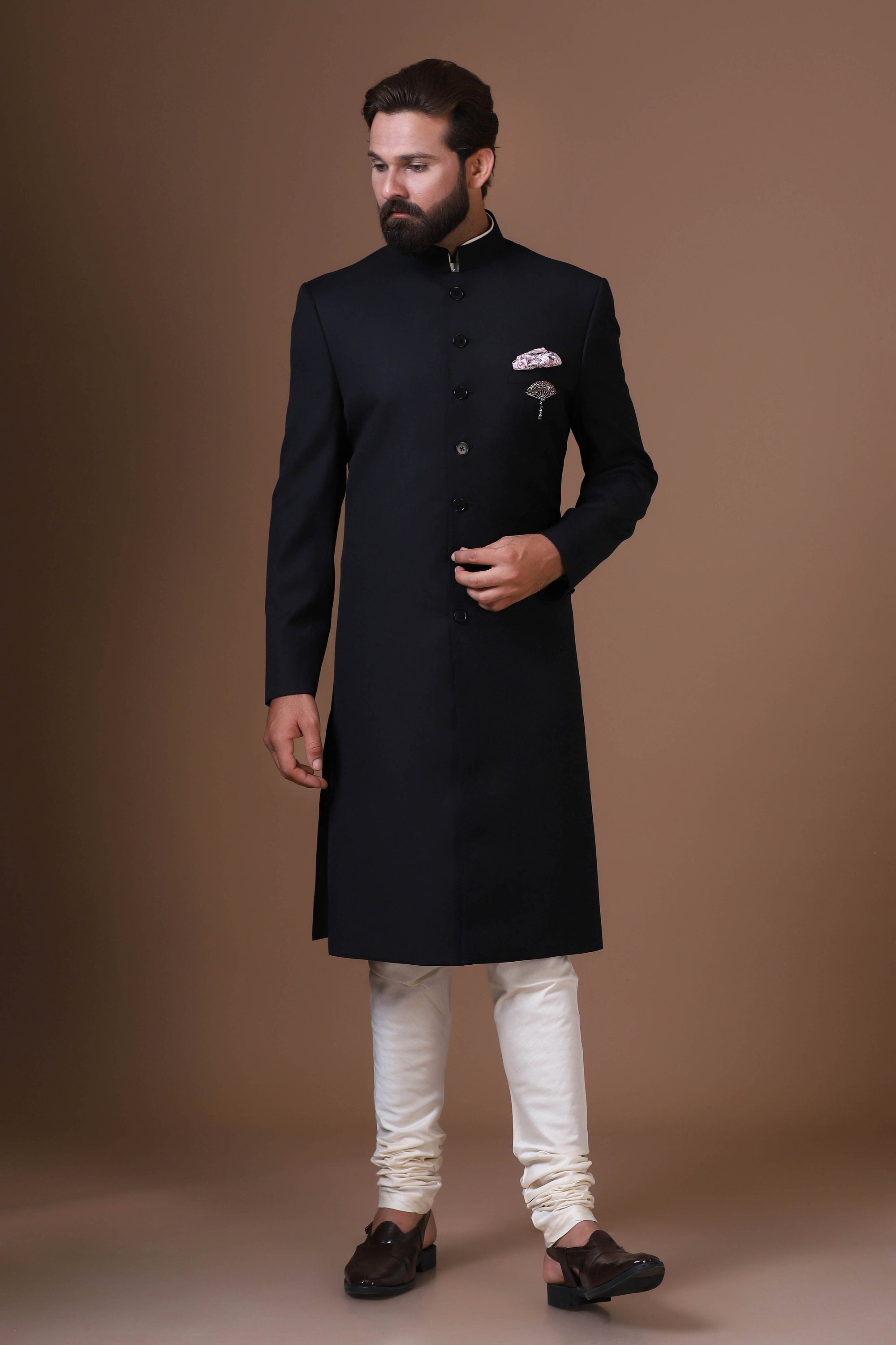 Our black Achkan, crafted from premium wool-rich fabric. Shop Now!