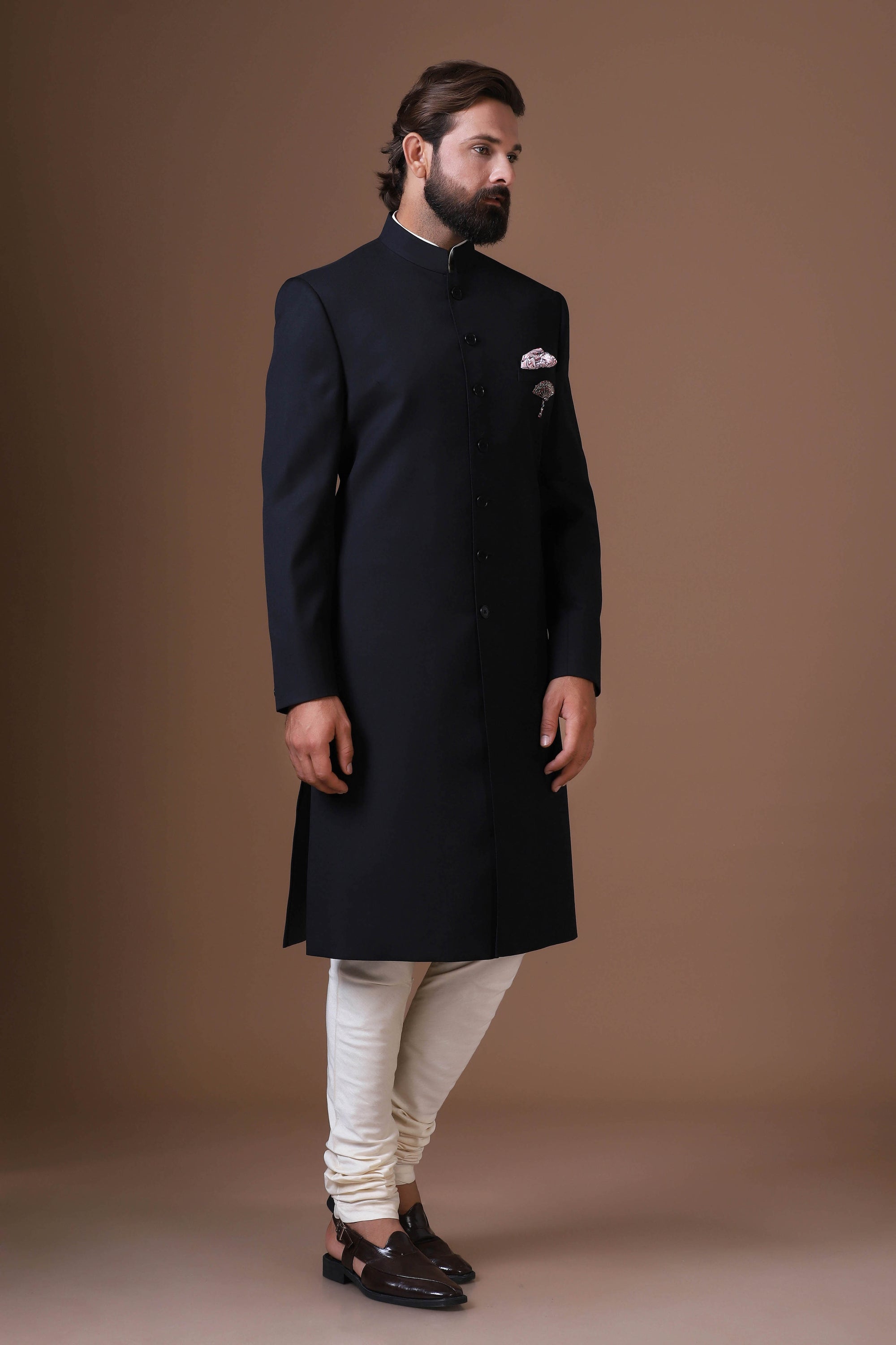 Our black Achkan, crafted from premium wool-rich fabric. Shop Now!