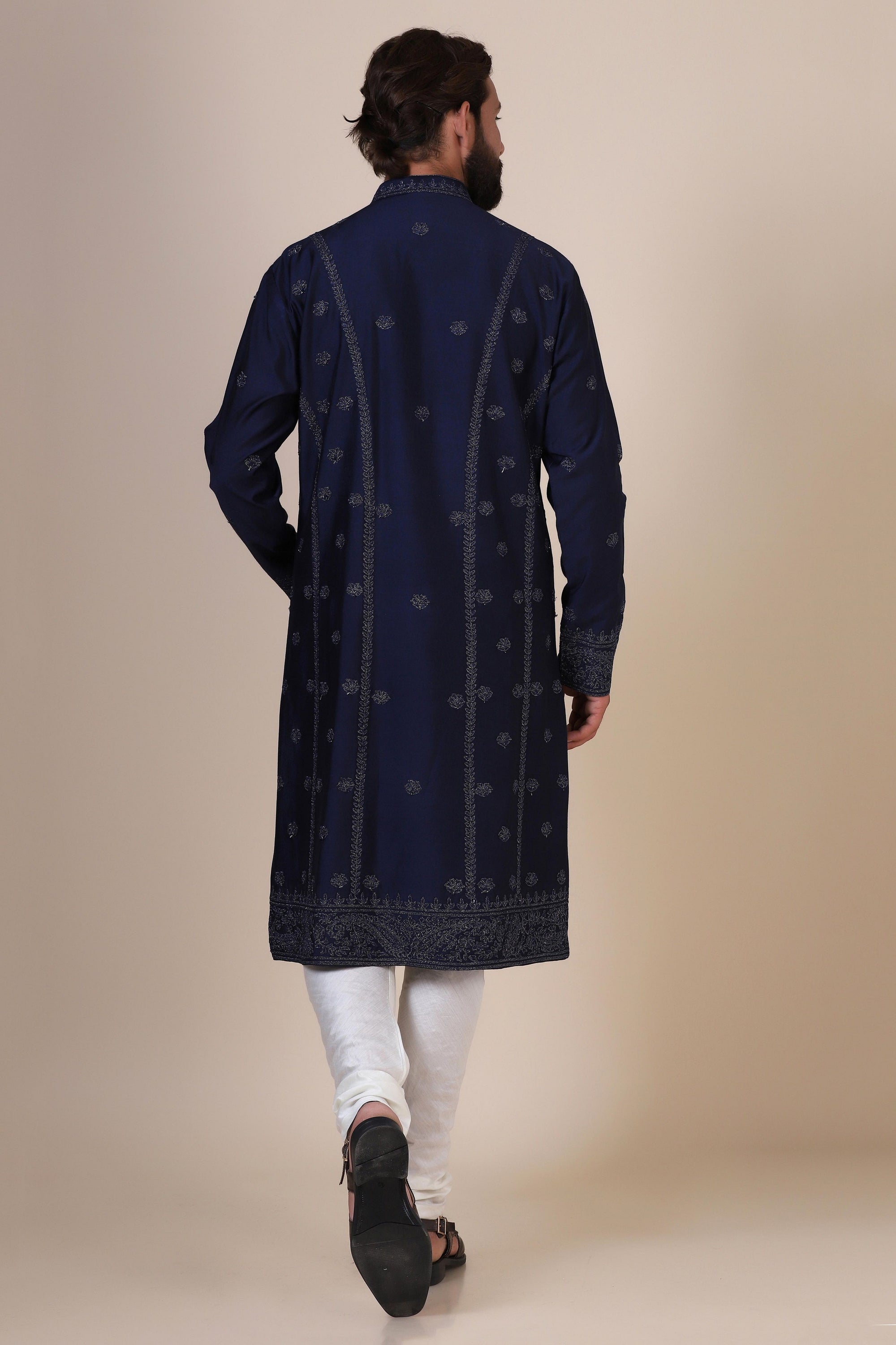 Elegance meets tradition in this Navy Kurta adorned with heavy silver embroidery. Shop Now!
