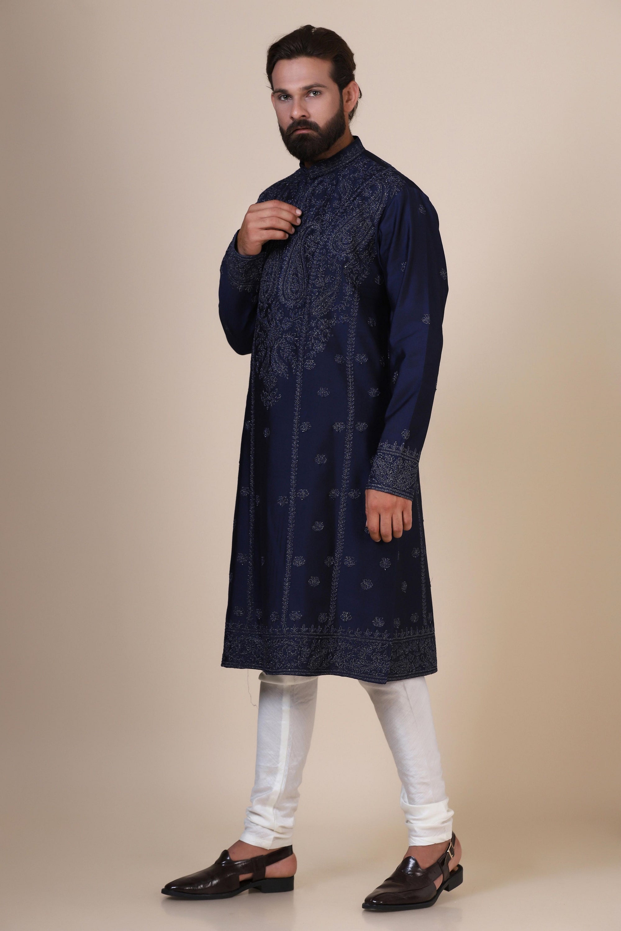 Elegance meets tradition in this Navy Kurta adorned with heavy silver embroidery. Shop Now!