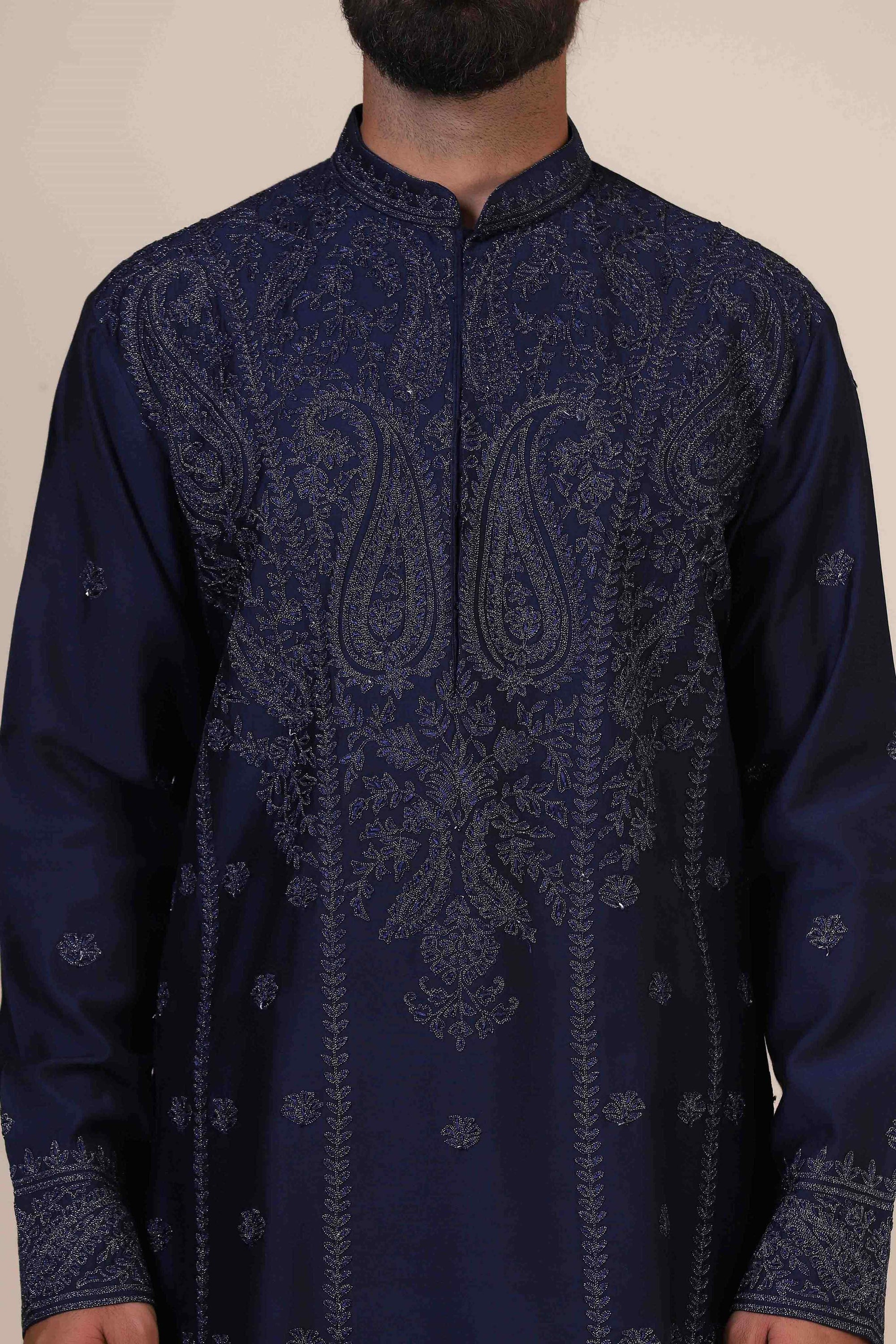 Elegance meets tradition in this Navy Kurta adorned with heavy silver embroidery. Shop Now!