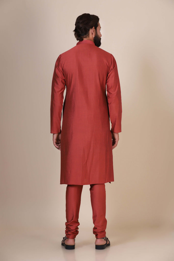 Experience comfort and radiance in our Rust kurta pajama, crafted from blended cotton and silk fabric. Delicate zigzag Pintucks adorn the front, adding a touch of elegance.