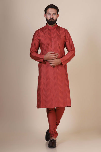 Experience comfort and radiance in our Rust kurta pajama, crafted from blended cotton and silk fabric. Delicate zigzag Pintucks adorn the front, adding a touch of elegance.