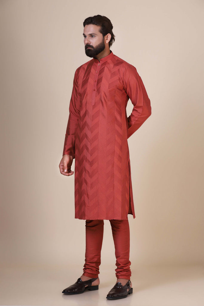 Experience comfort and radiance in our Rust kurta pajama, crafted from blended cotton and silk fabric. Delicate zigzag Pintucks adorn the front, adding a touch of elegance.