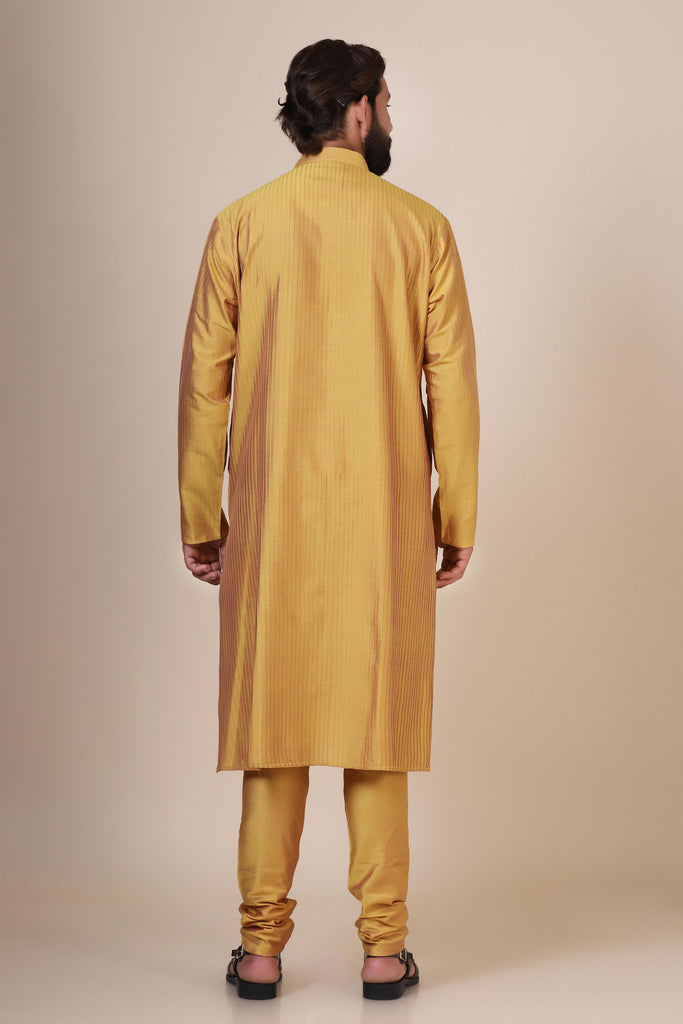 Radiate elegance and comfort in our Yellow kurta pajama, tailored from blended cotton and silk fabric. Delicate zigzag Pintucks grace the front, adding a touch of sophistication.