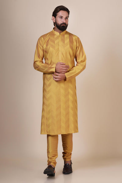 Radiate elegance and comfort in our Yellow kurta pajama, tailored from blended cotton and silk fabric. Delicate zigzag Pintucks grace the front, adding a touch of sophistication.