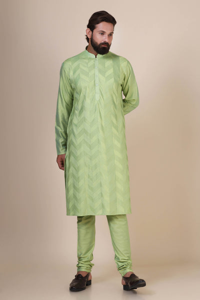 Elevate your style with comfort in our Green kurta pajama, crafted from blended cotton and silk fabric. Delicate zigzag Pintucks adorn the front, adding a touch of sophistication.