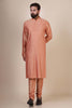 Embrace elegance and comfort in our Peach kurta pajama, tailored from blended cotton and silk fabric. Delicate Pintucks grace the front, adding a touch of sophistication.
