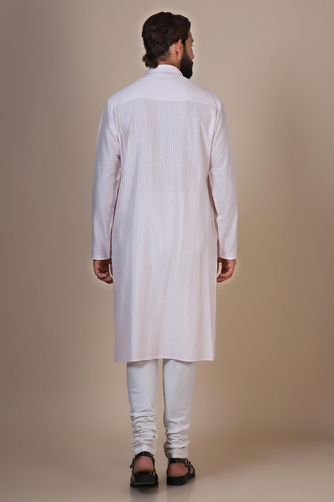 Step into comfort and style with our Pink kurta pajama, tailored from blended cotton and silk fabric. Delicate Pintucks adorn the front, adding a touch of elegance.