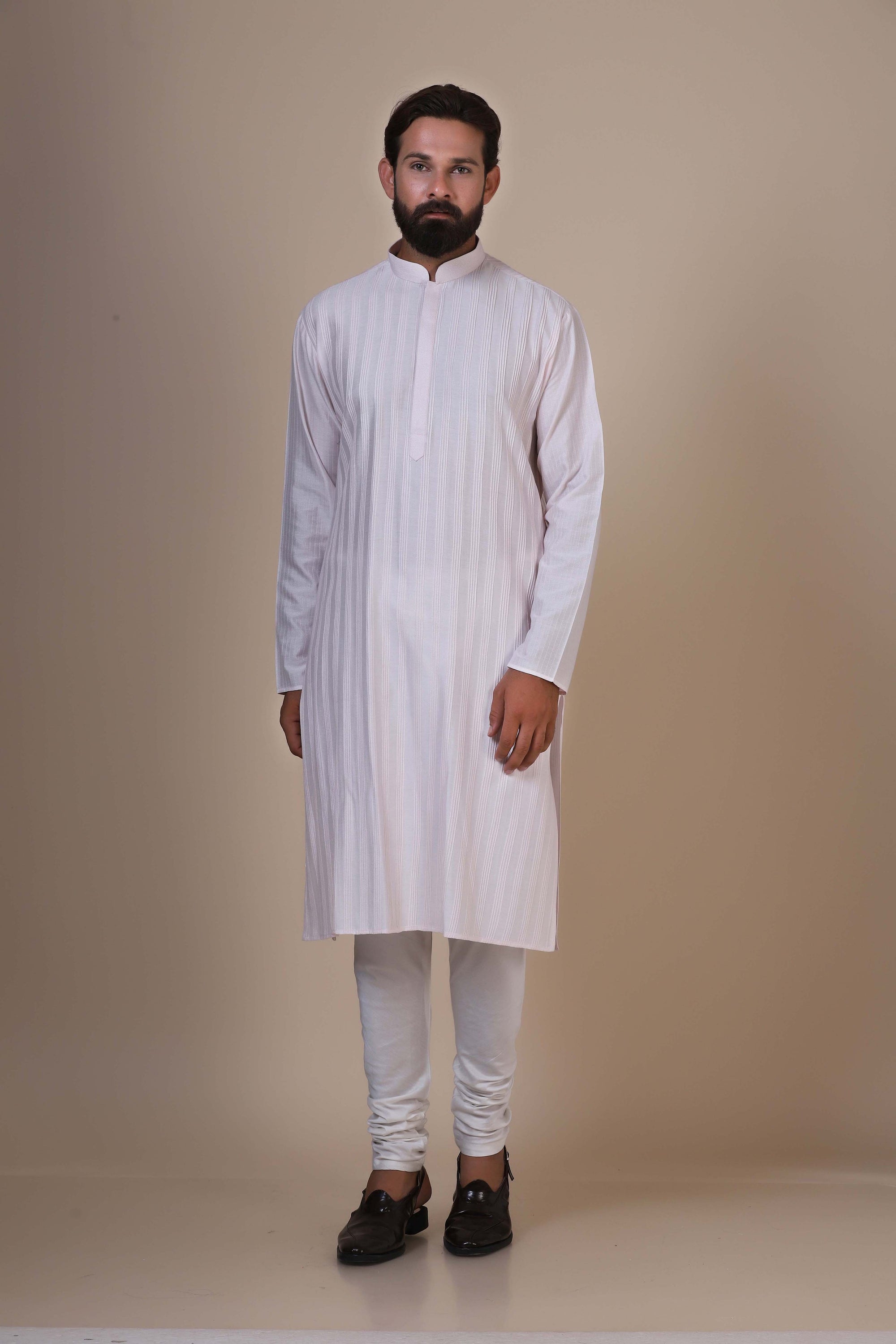 Step into comfort and style with our Pink kurta pajama, tailored from blended cotton. Shop Now!