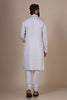 Experience comfort and elegance in our White kurta pajama, crafted from blended cotton and silk fabric. Subtle embroidery accents the neck and button placket, adding a touch of sophistication.