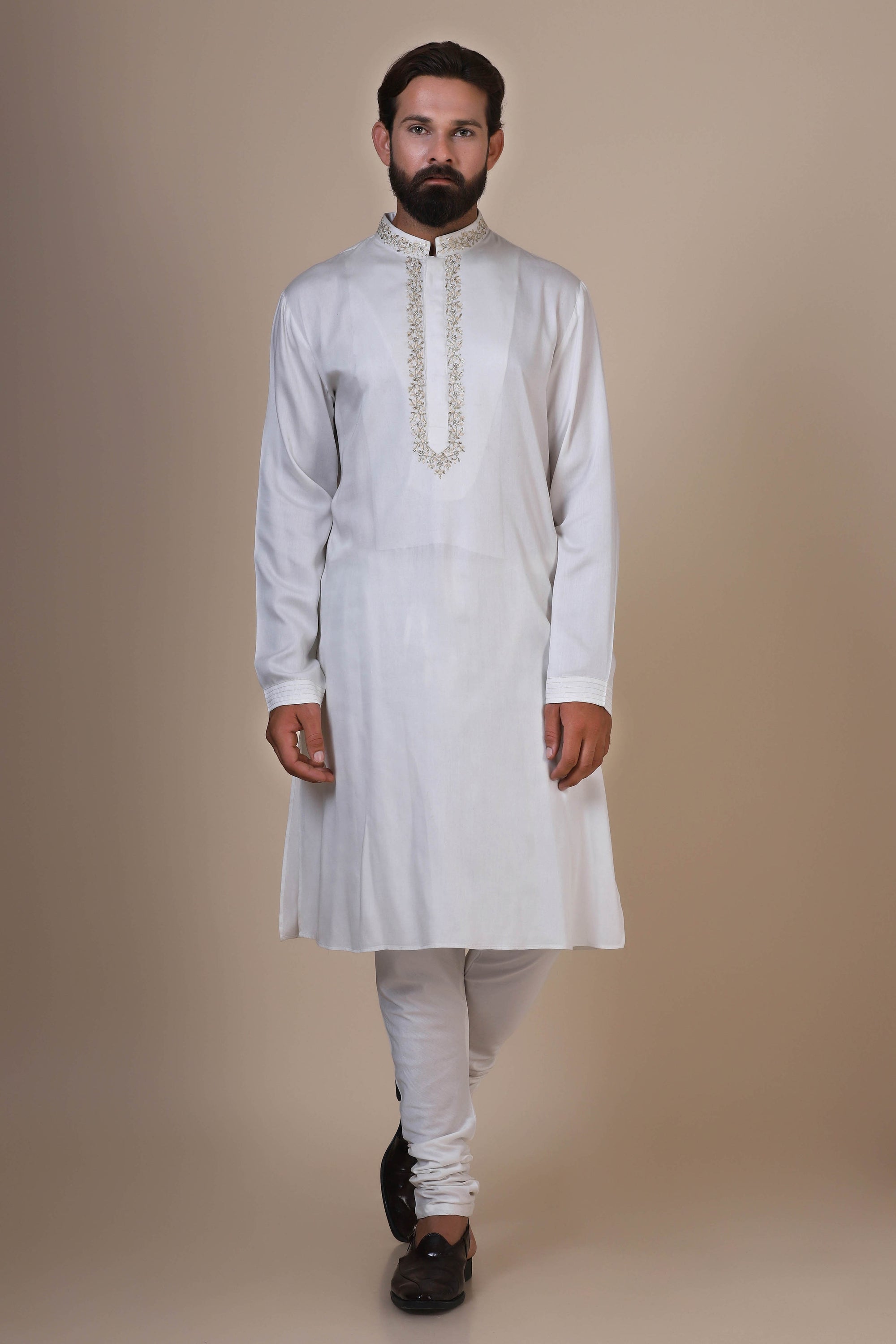 Experience comfort in our White kurta pajama, crafted from blended cotton and silk fabric. Shop Now!