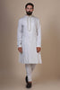 Experience comfort and elegance in our White kurta pajama, crafted from blended cotton and silk fabric. Subtle embroidery accents the neck and button placket, adding a touch of sophistication.
