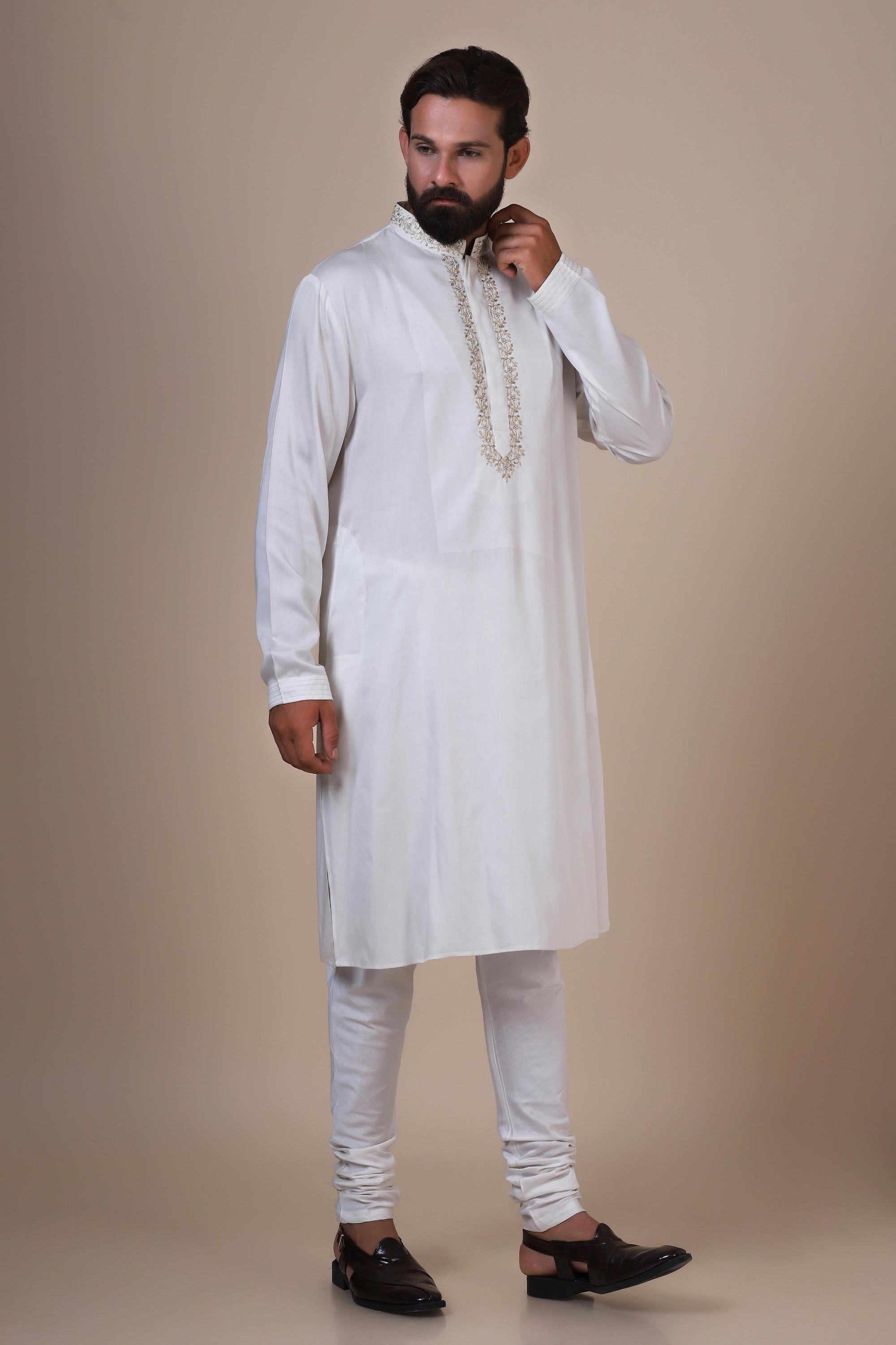 Experience comfort in our White kurta pajama, crafted from blended cotton and silk fabric. Shop Now!