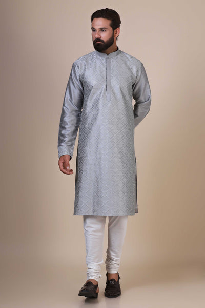 Indulge in comfort and style with our Grey kurta pajama, crafted from blended cotton and silk fabric. Delicate geometric embroidery adorns the front, adding a touch of sophistication.