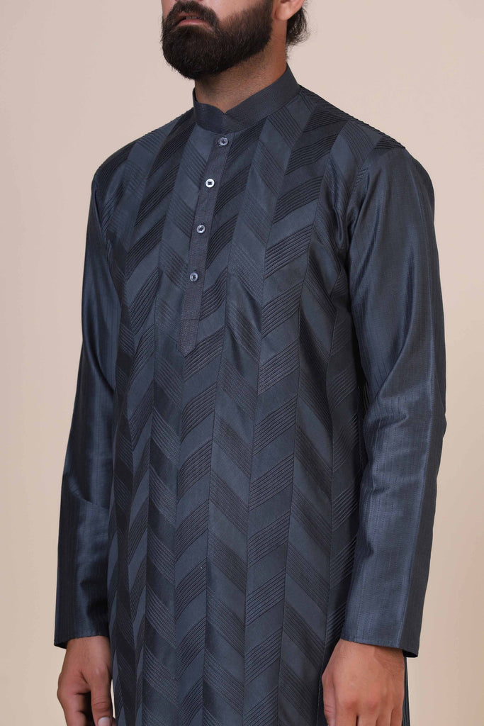 Wrap yourself in comfort and elegance with our Grey kurta pajama, tailored from blended cotton and silk fabric. Delicate zigzag Pintucks adorn the front for added style.