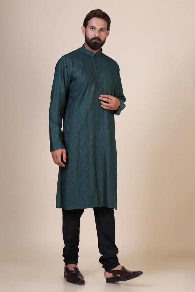 Experience comfort and radiance in our Green kurta pajama, crafted from blended cotton and silk fabric. Delicate zigzag Pintucks adorn the front, adding a touch of elegance.